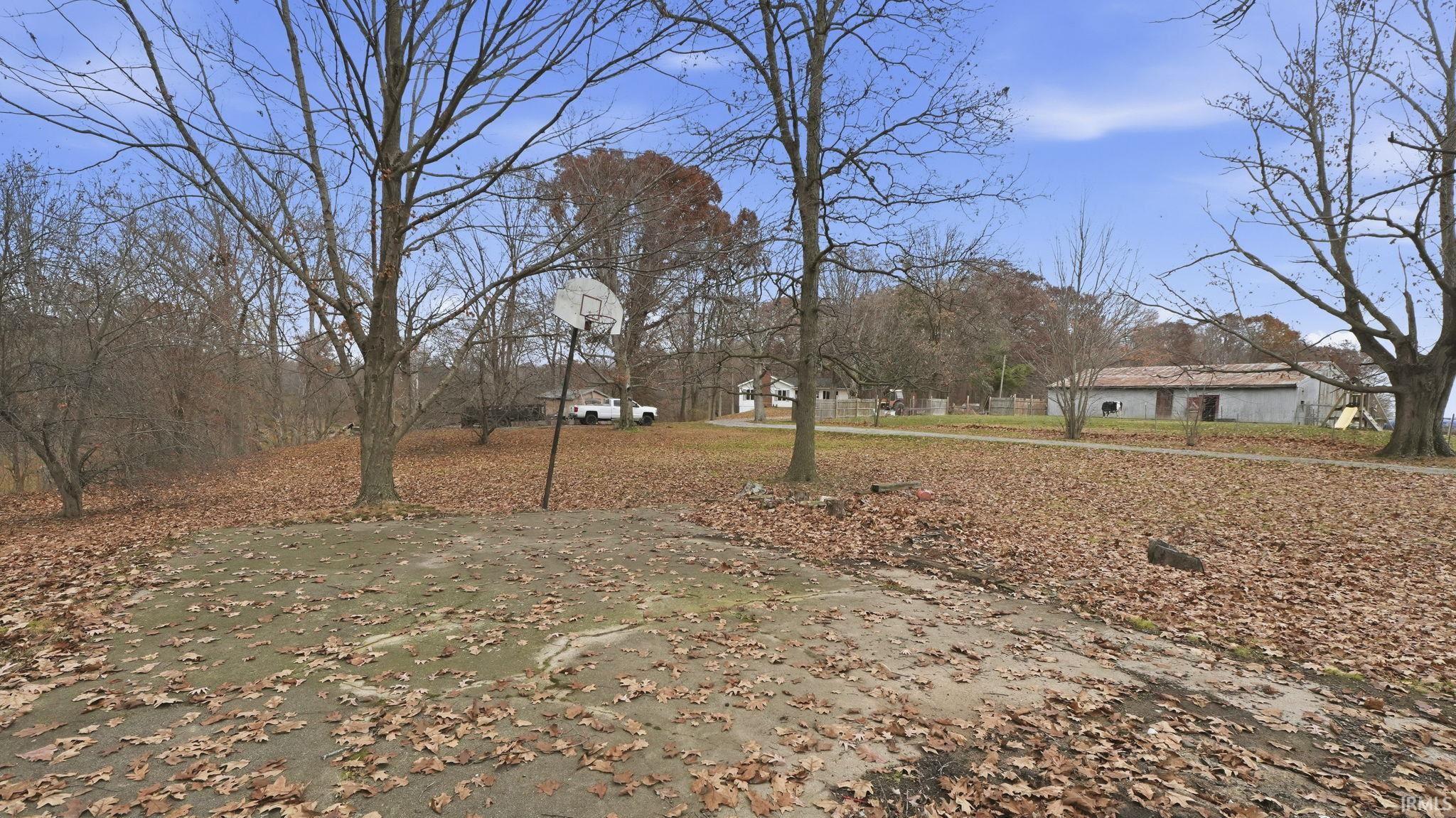 View of yard with community basketball court