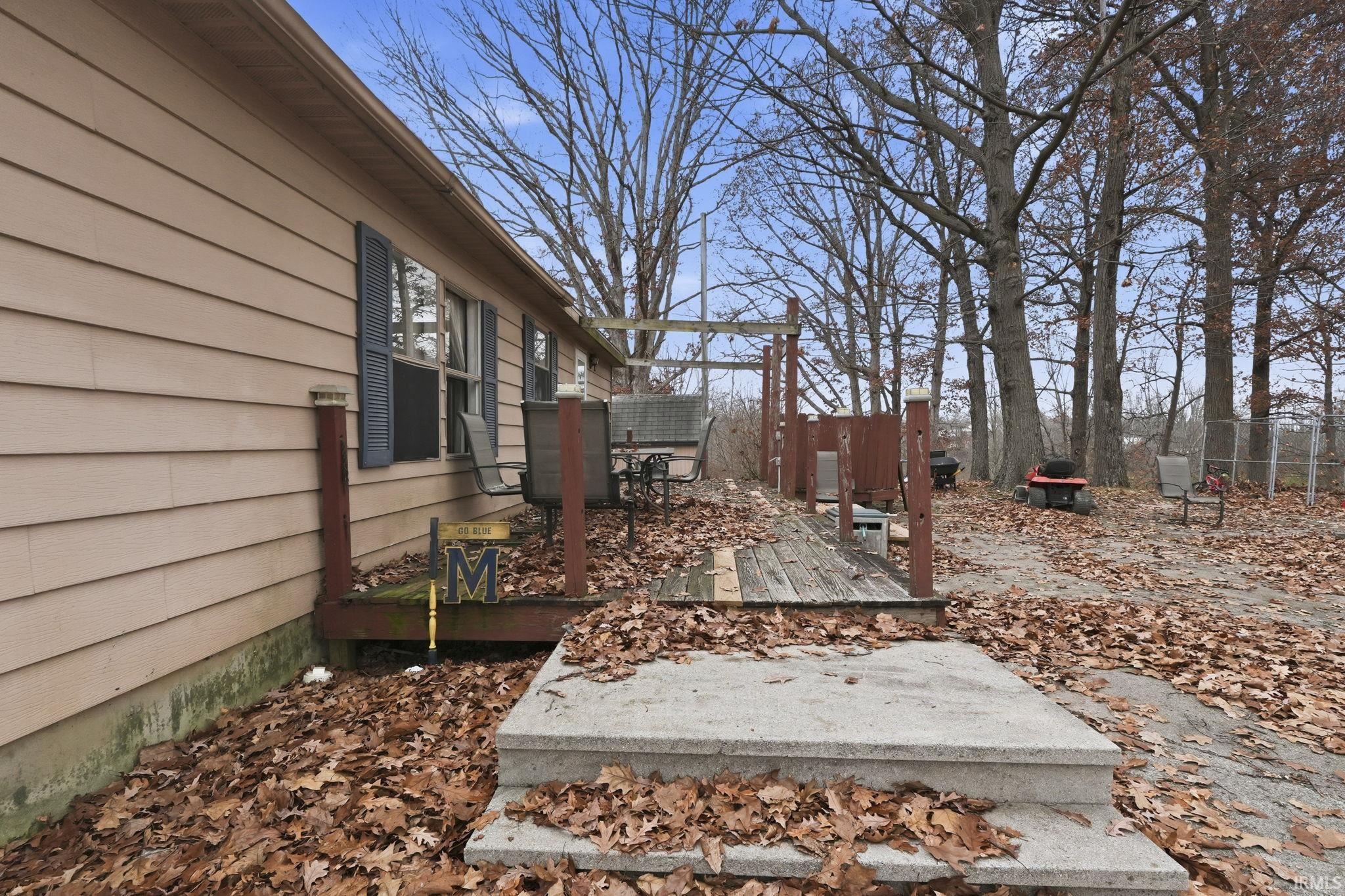 View of yard with a wooden deck