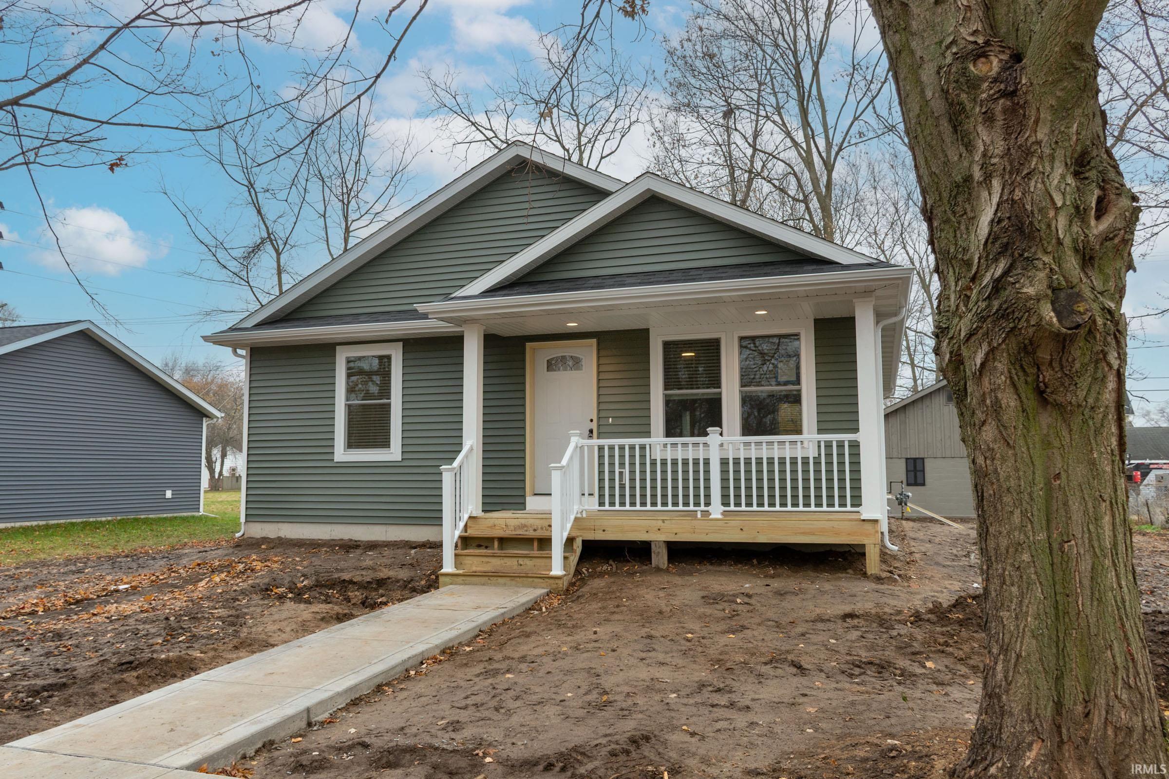 Bungalow-style home with a porch