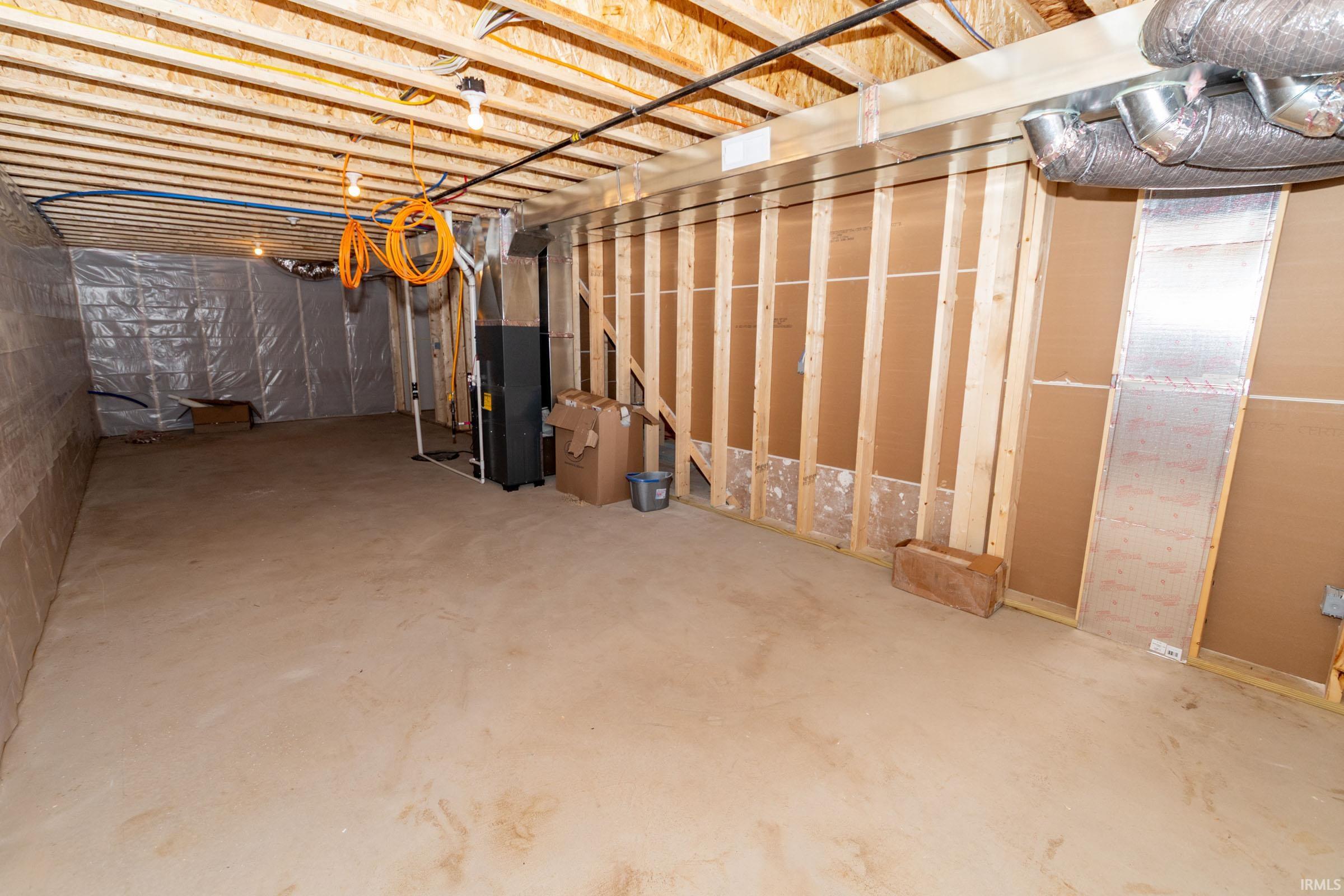 Unfinished basement with heating unit