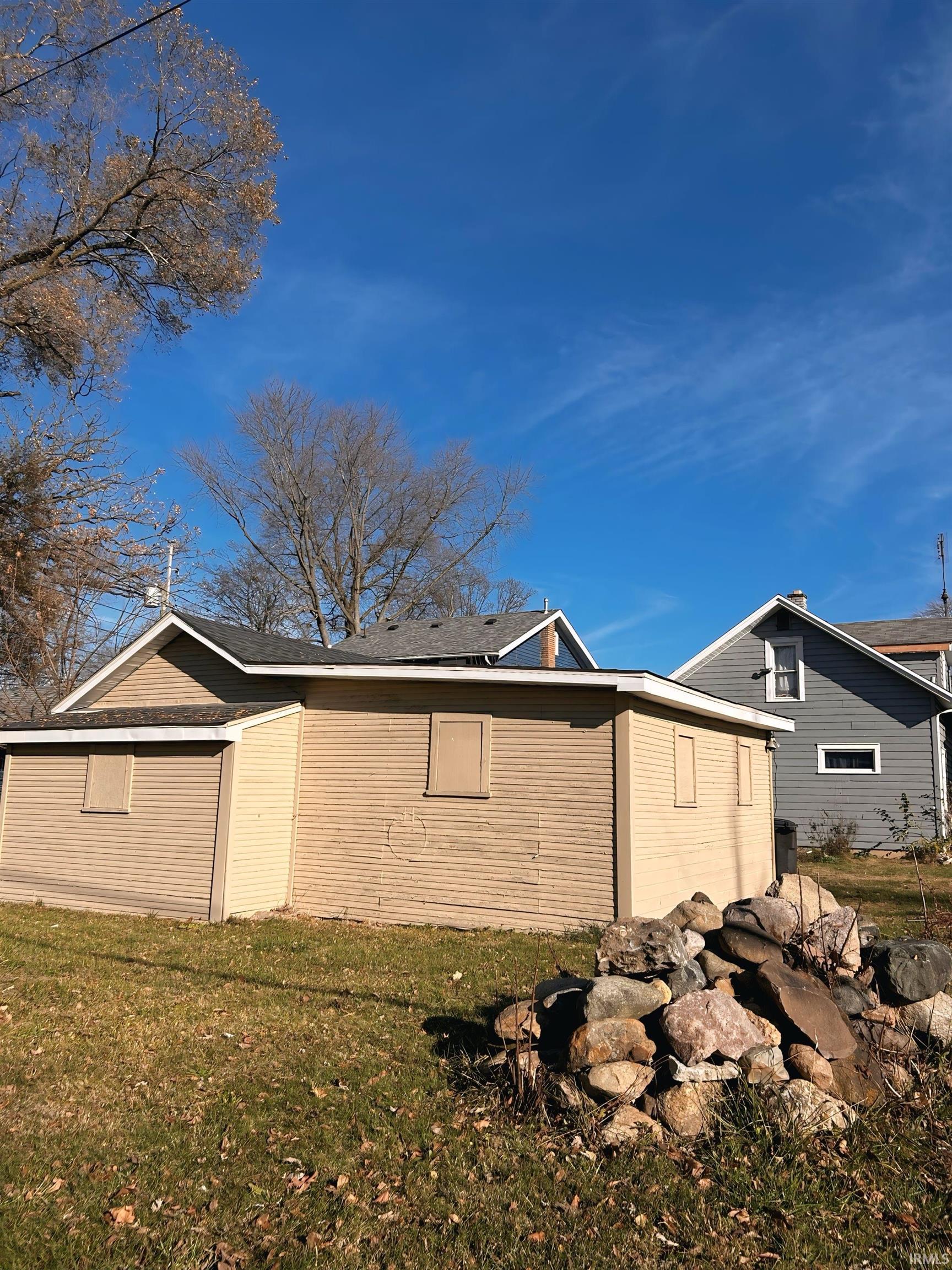 View of home's exterior featuring a lawn