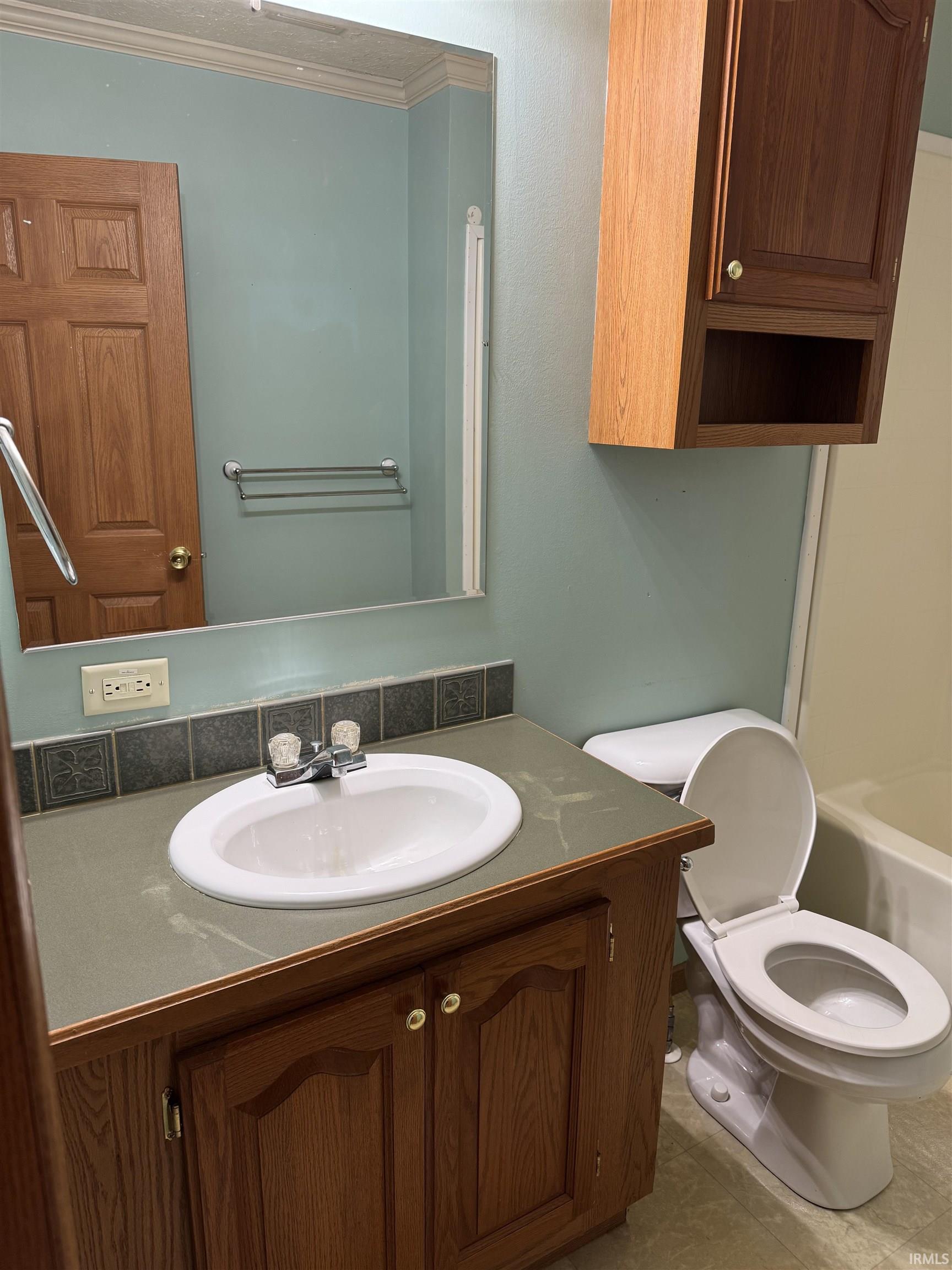 Bathroom with vanity and tile patterned floors