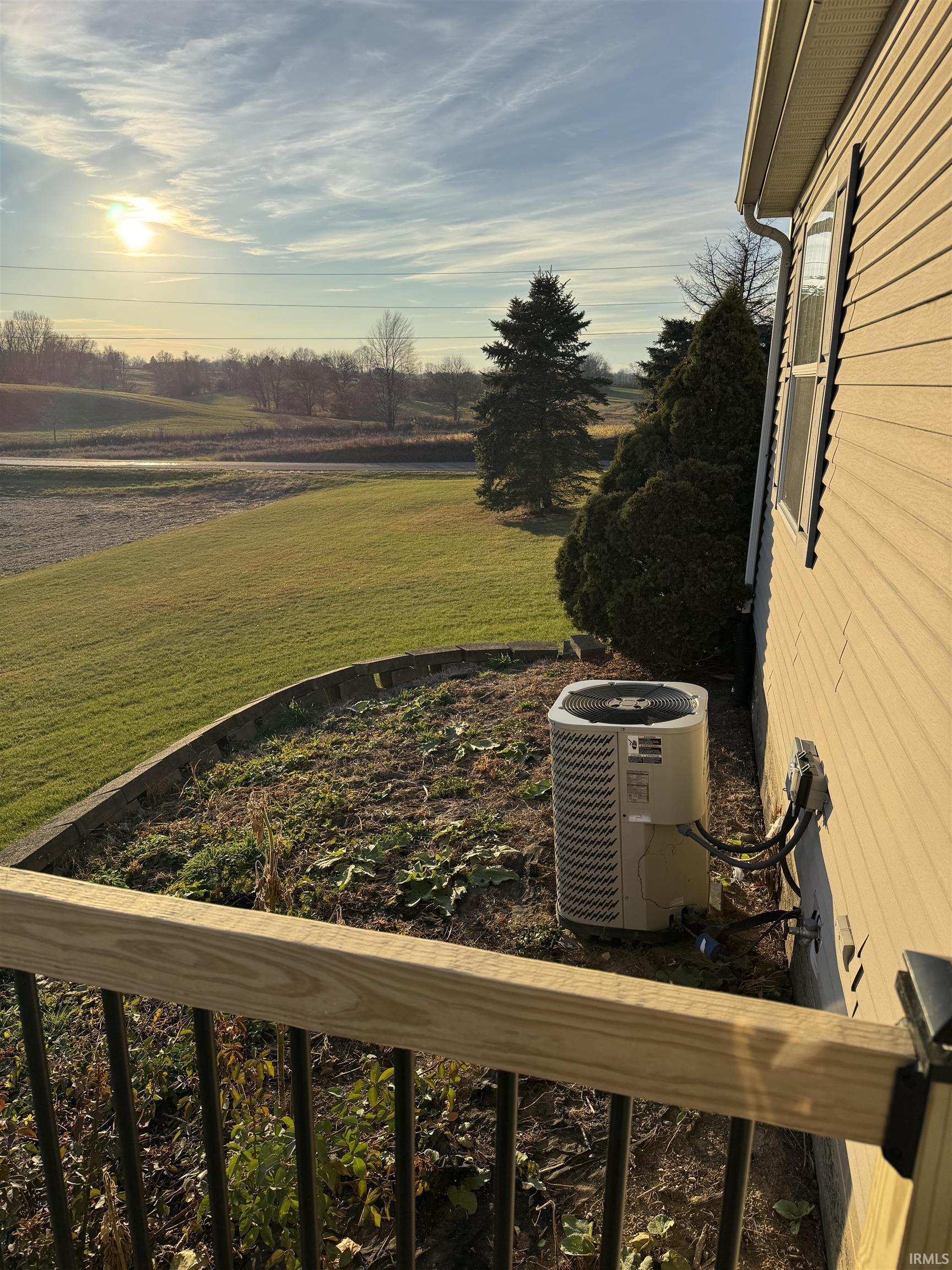 View of green lawn with a view of rural / pastoral area