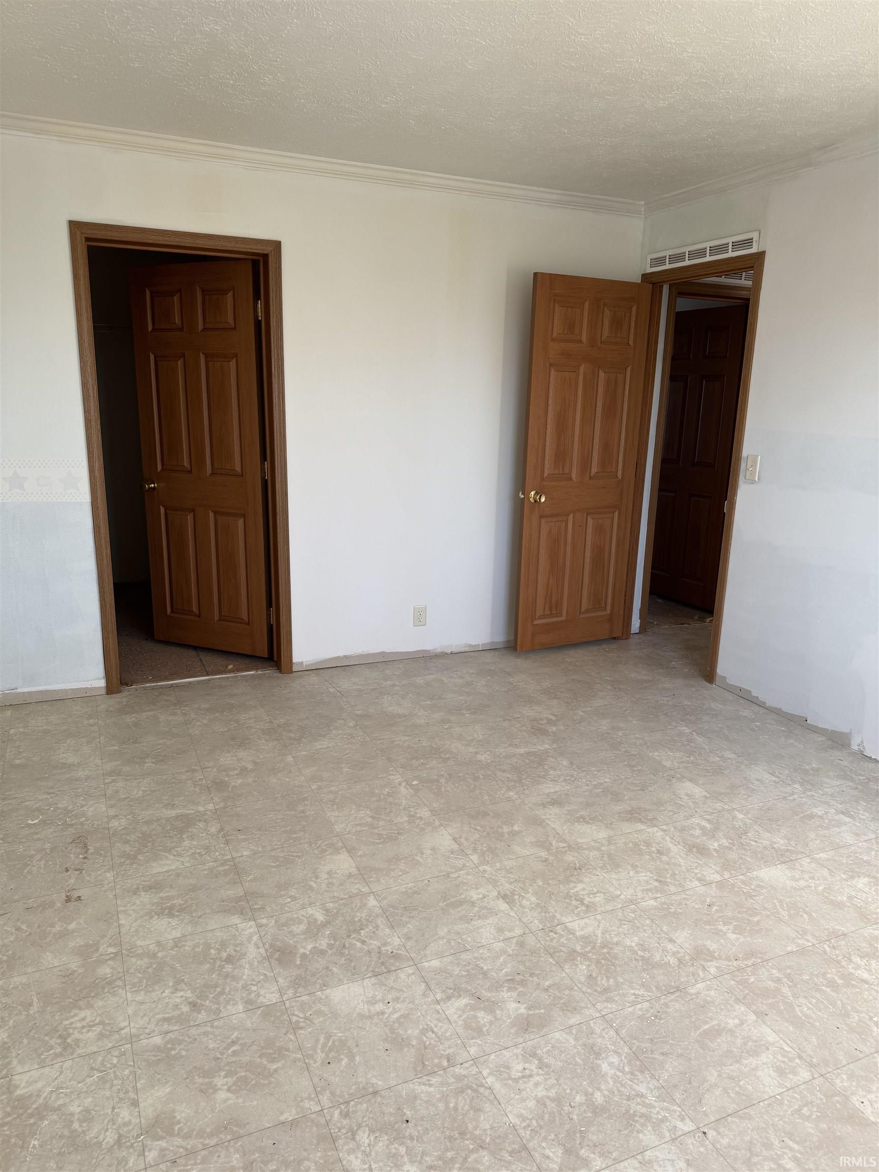 Spare room with a textured ceiling