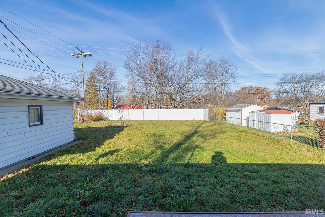 View of fenced backyard