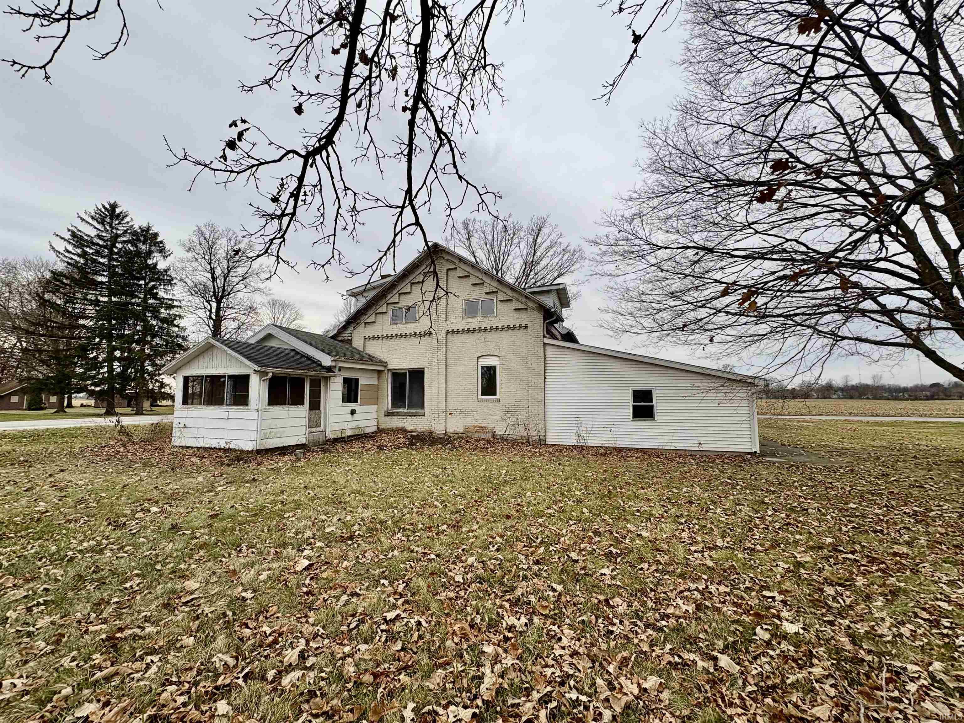 Rear view of house with a lawn