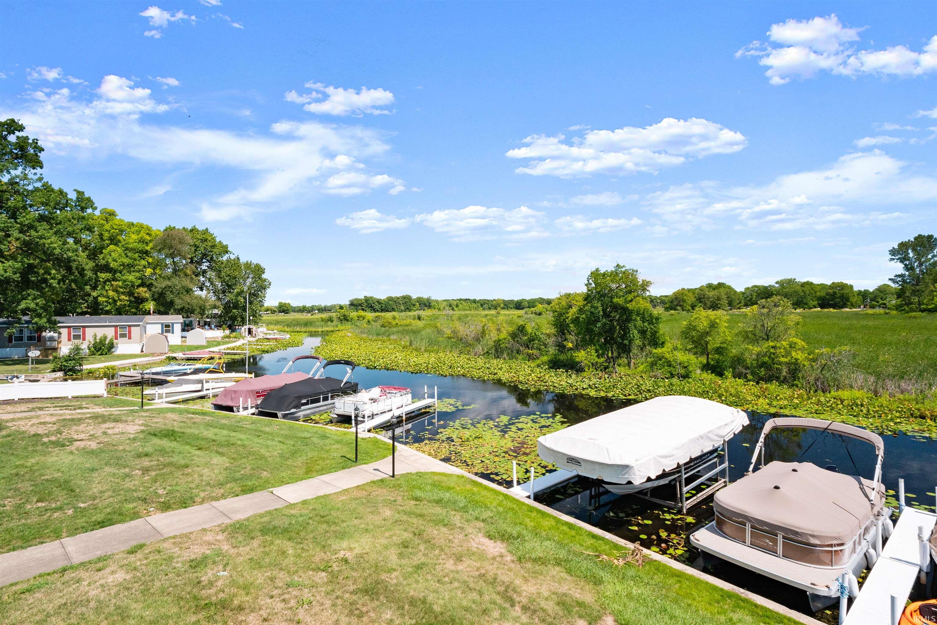 Aerial view of a large body of water and a tree filled landscape