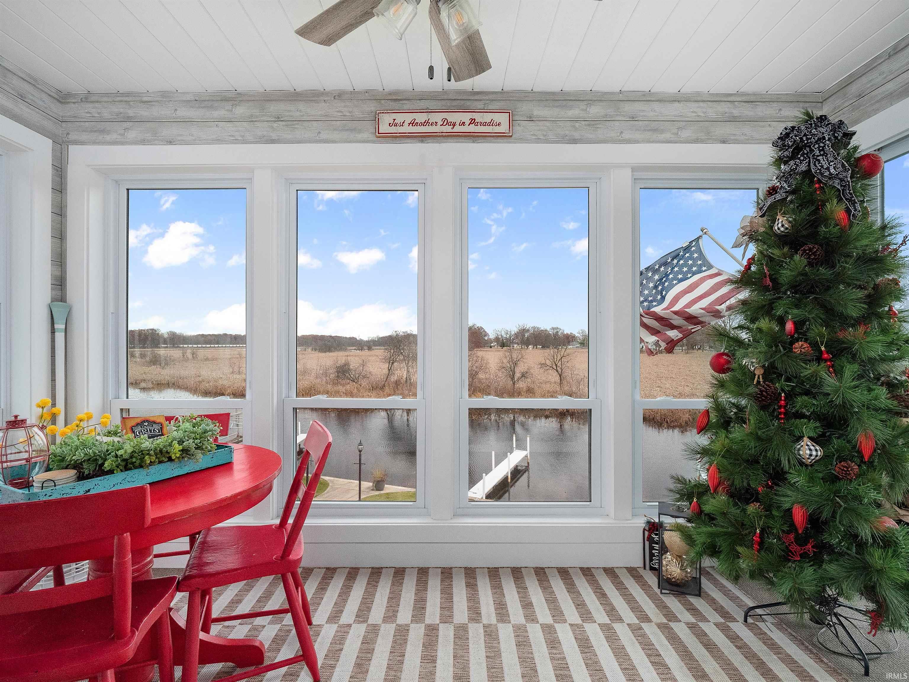 Sunroom / solarium featuring wooden ceiling