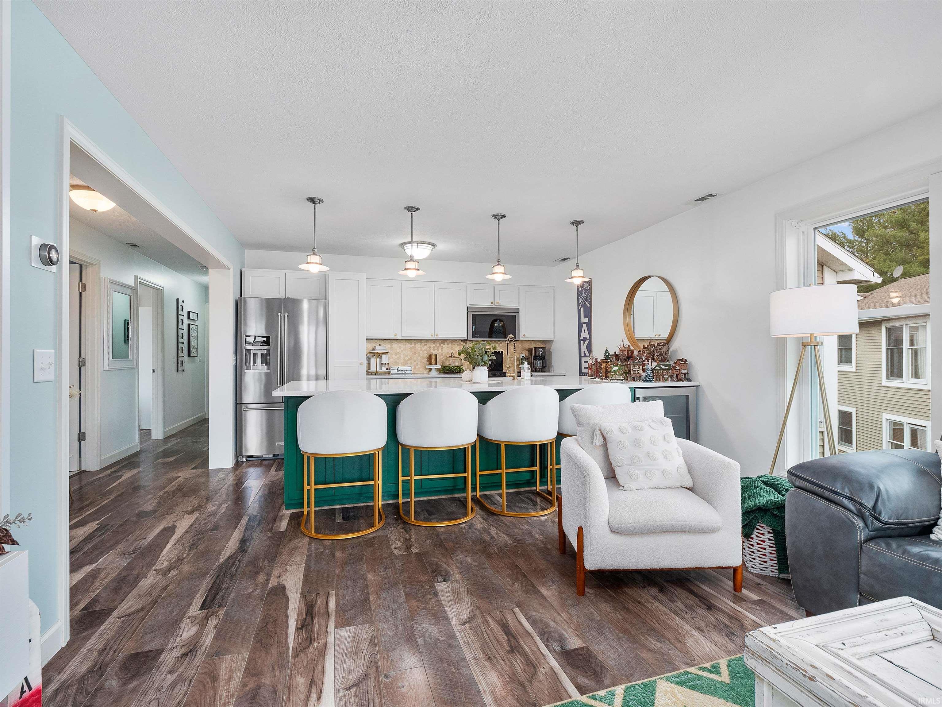 Living area with dark wood-type flooring