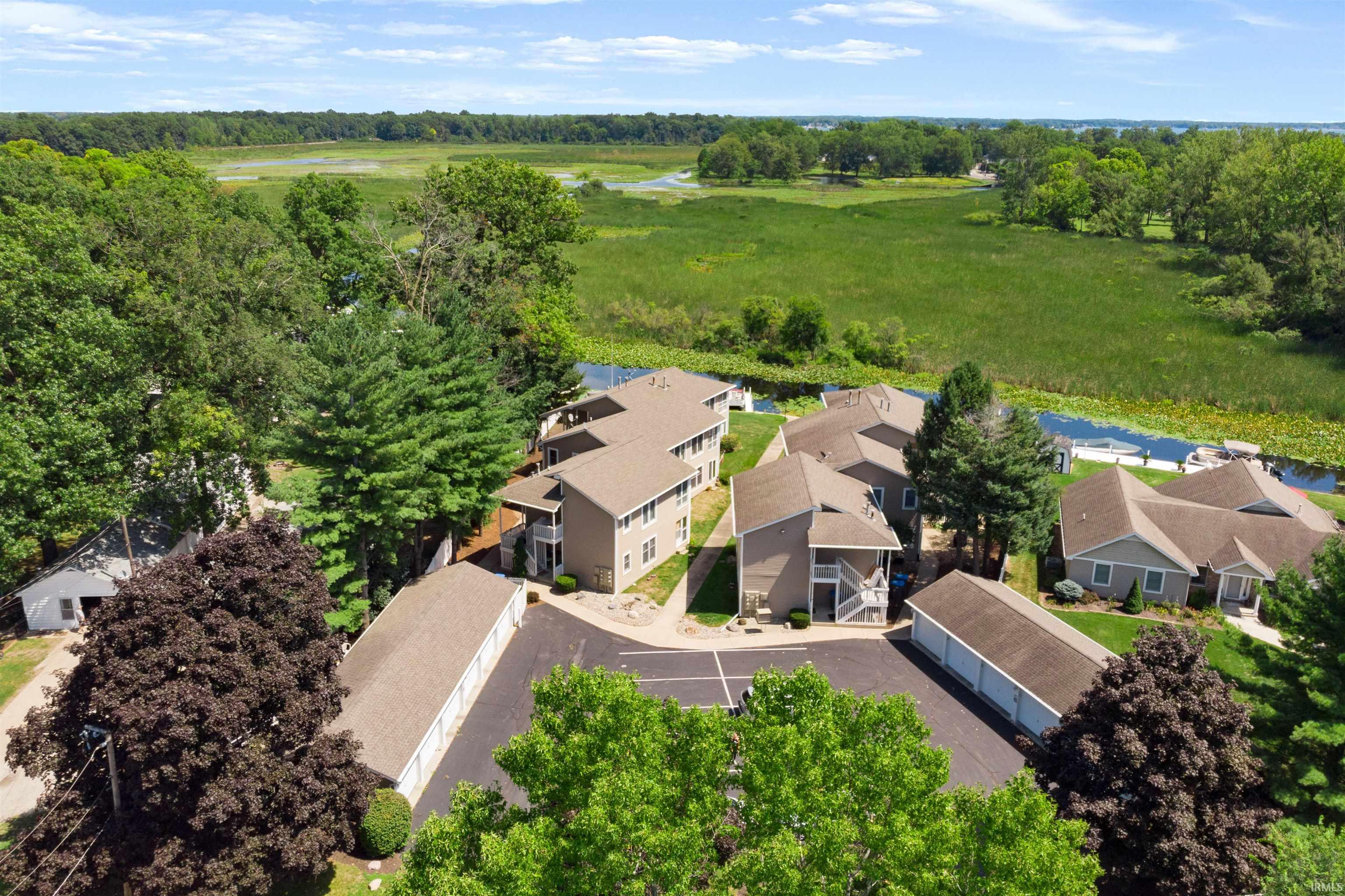 Aerial perspective of suburban area with a tree filled landscape