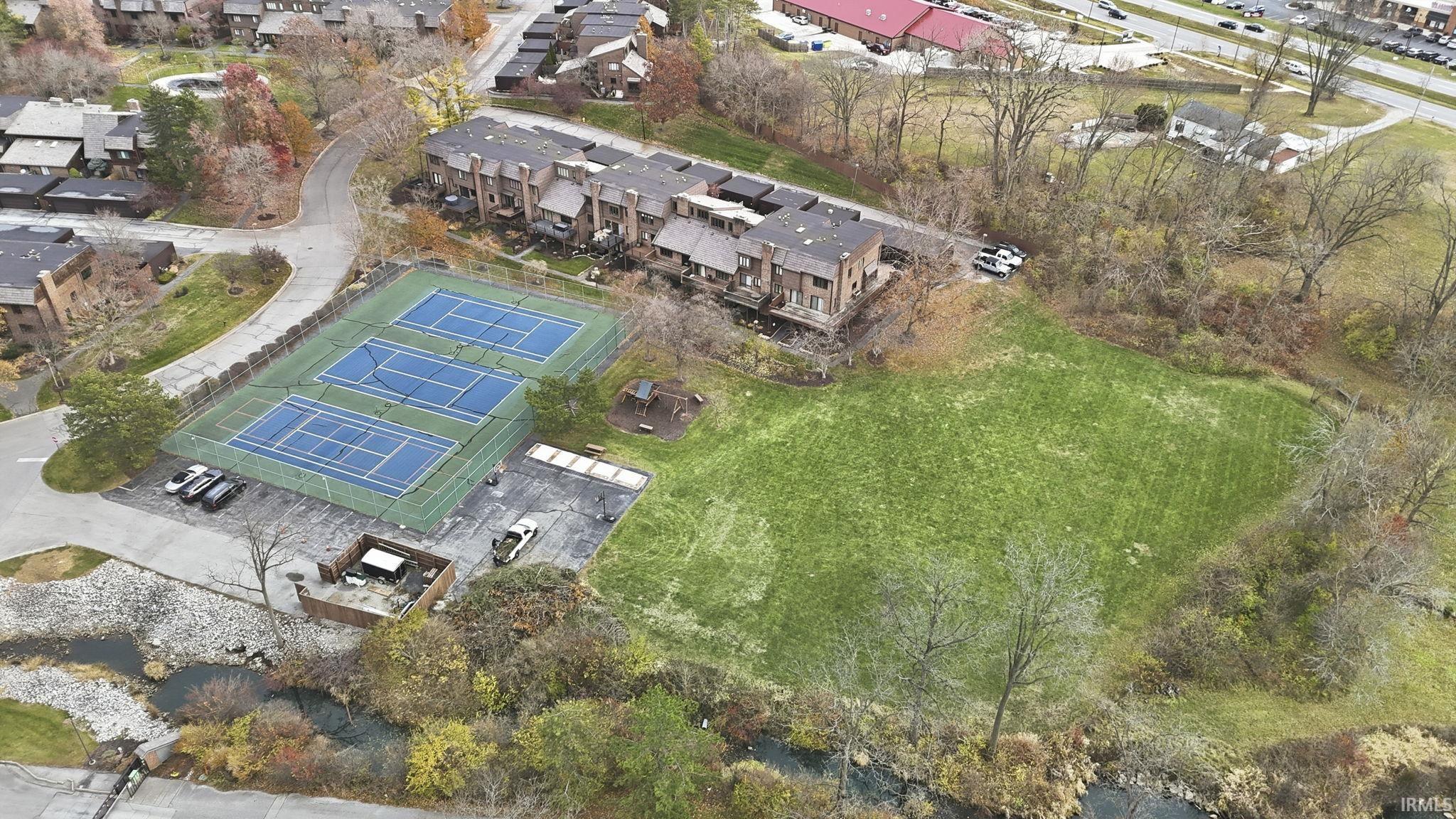 Aerial view of property's location with nearby suburban area