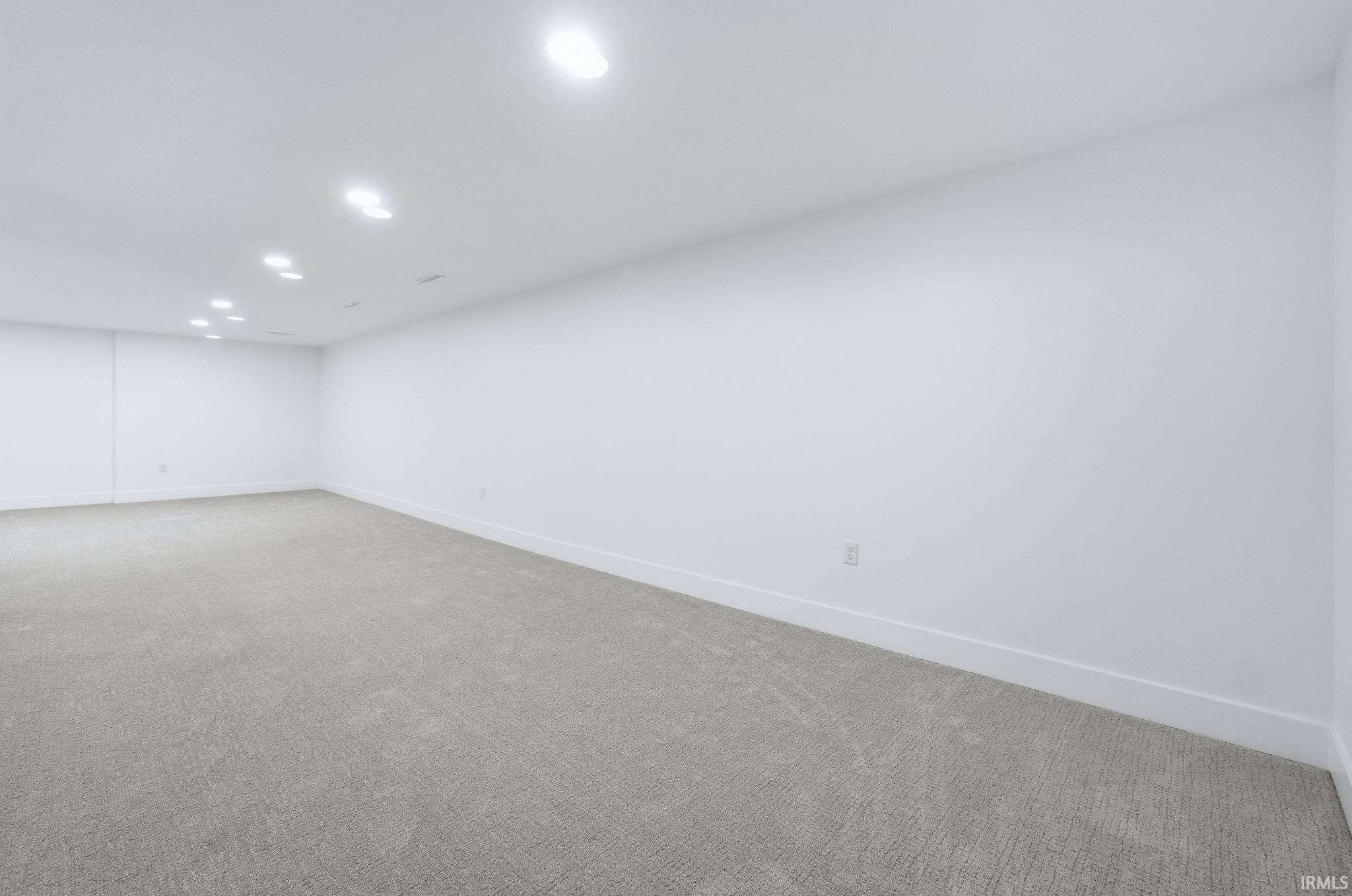 Below grade area with carpet and recessed lighting