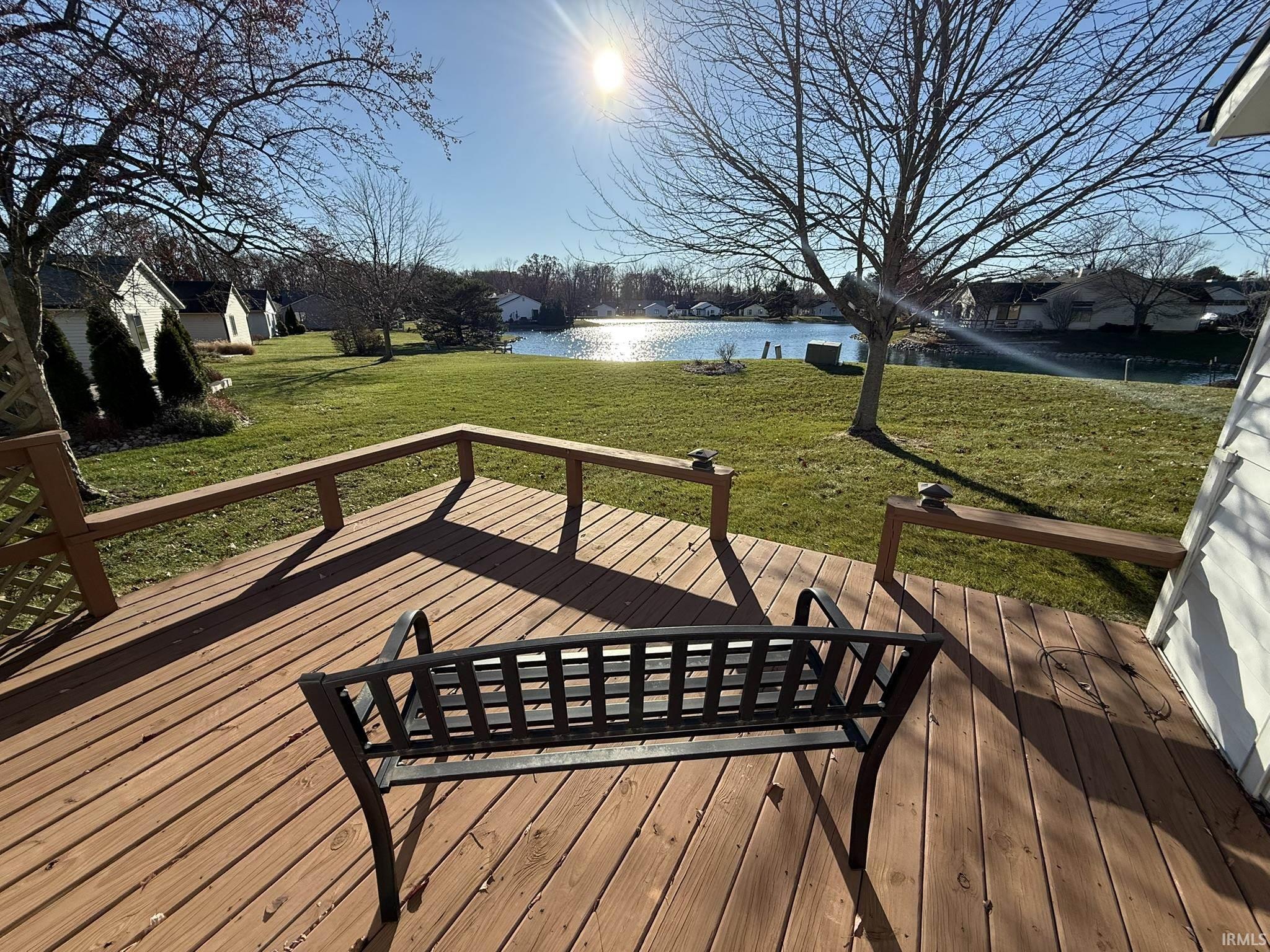 Deck featuring a yard and a water view