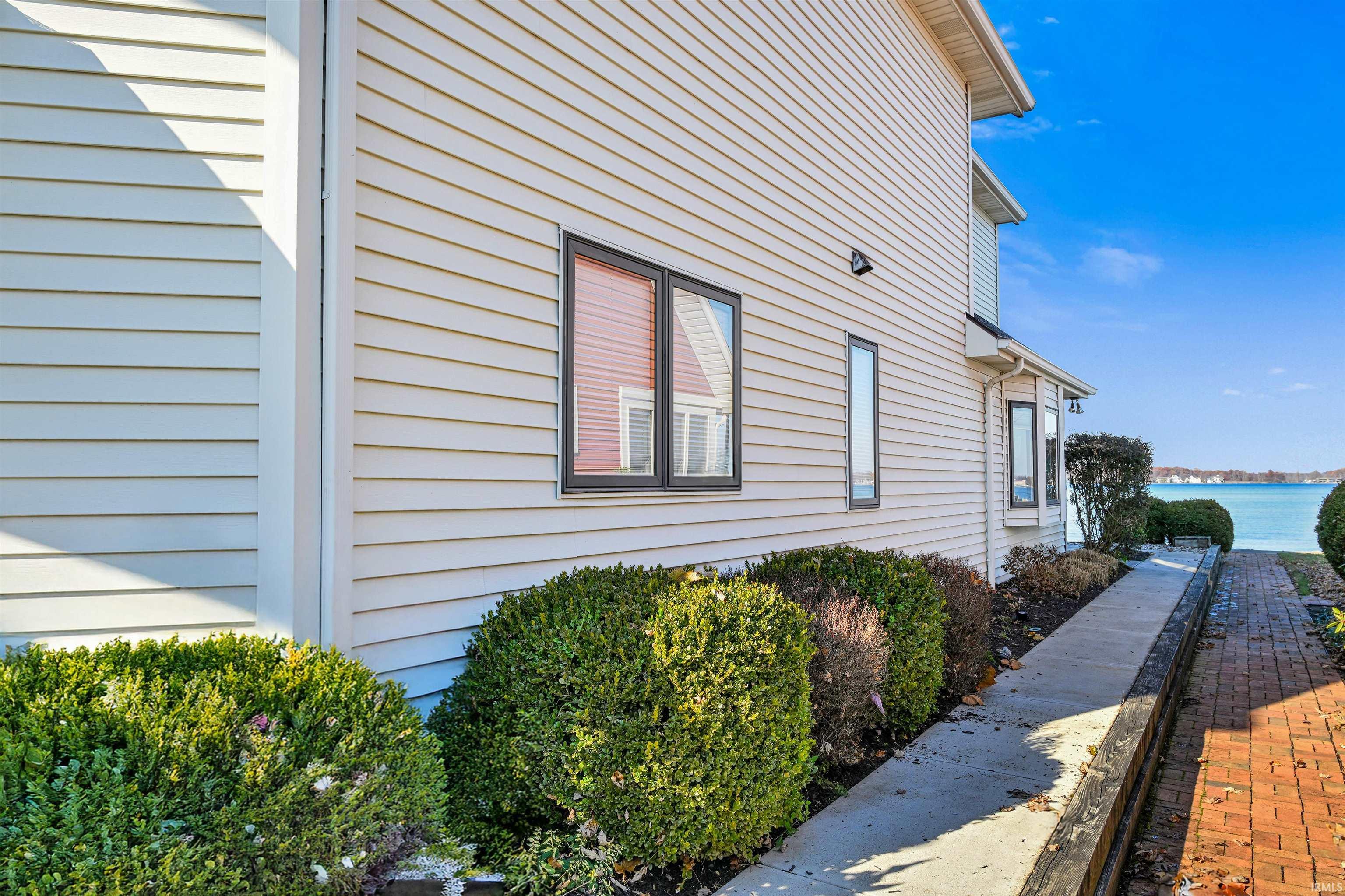 View of side of property featuring a water view