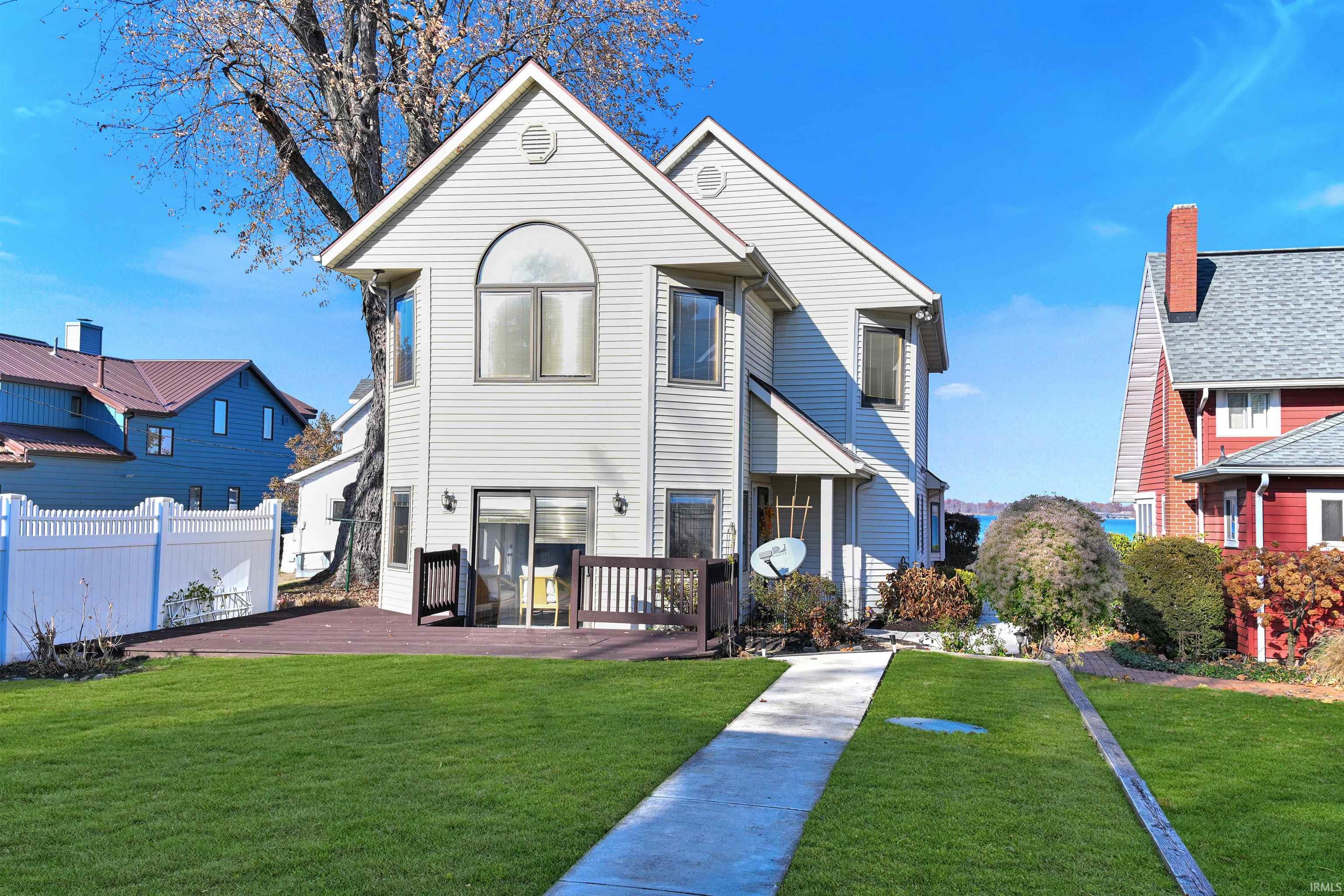 Rear view of property featuring a deck