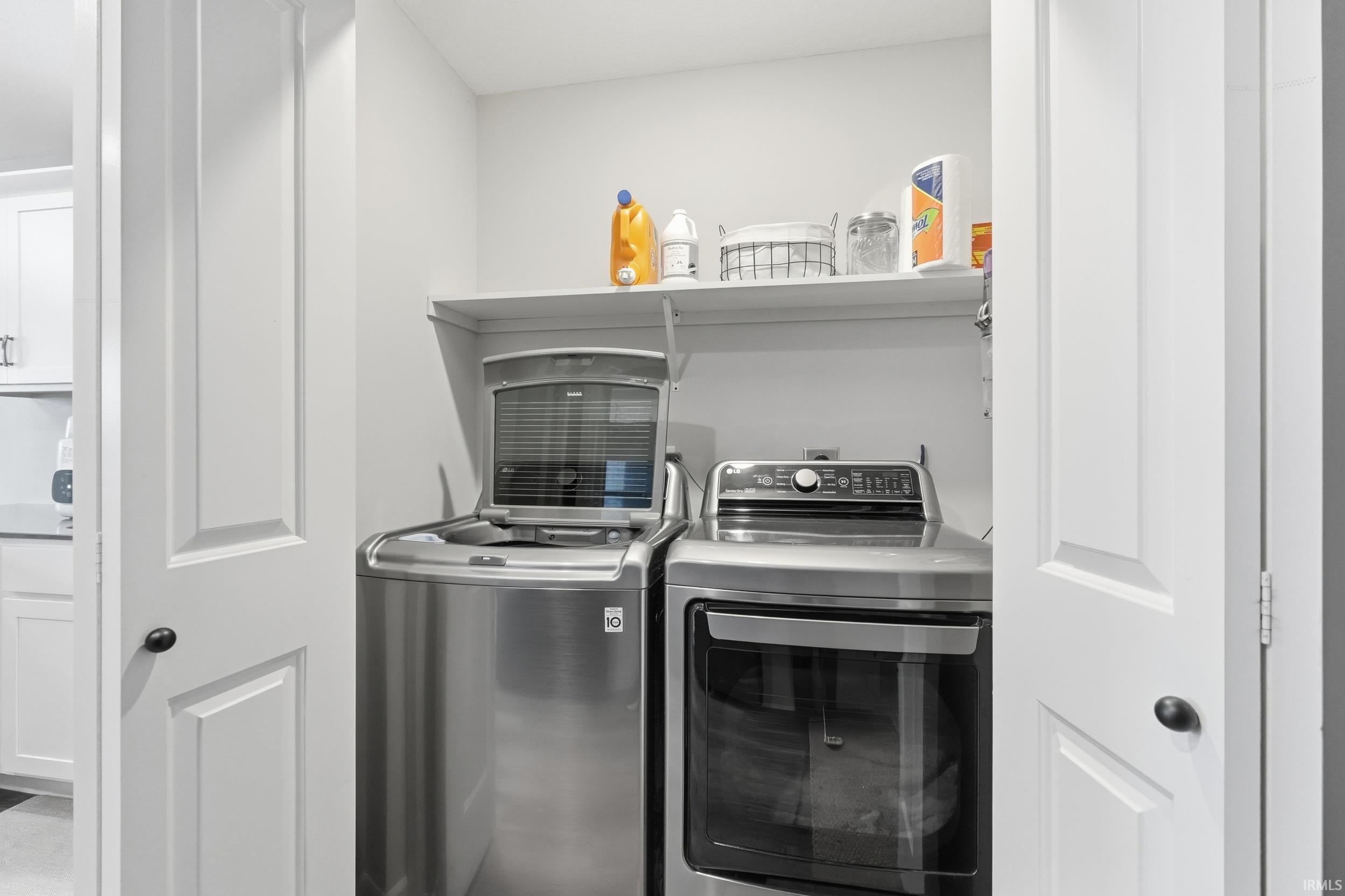 Washroom with washing machine and dryer