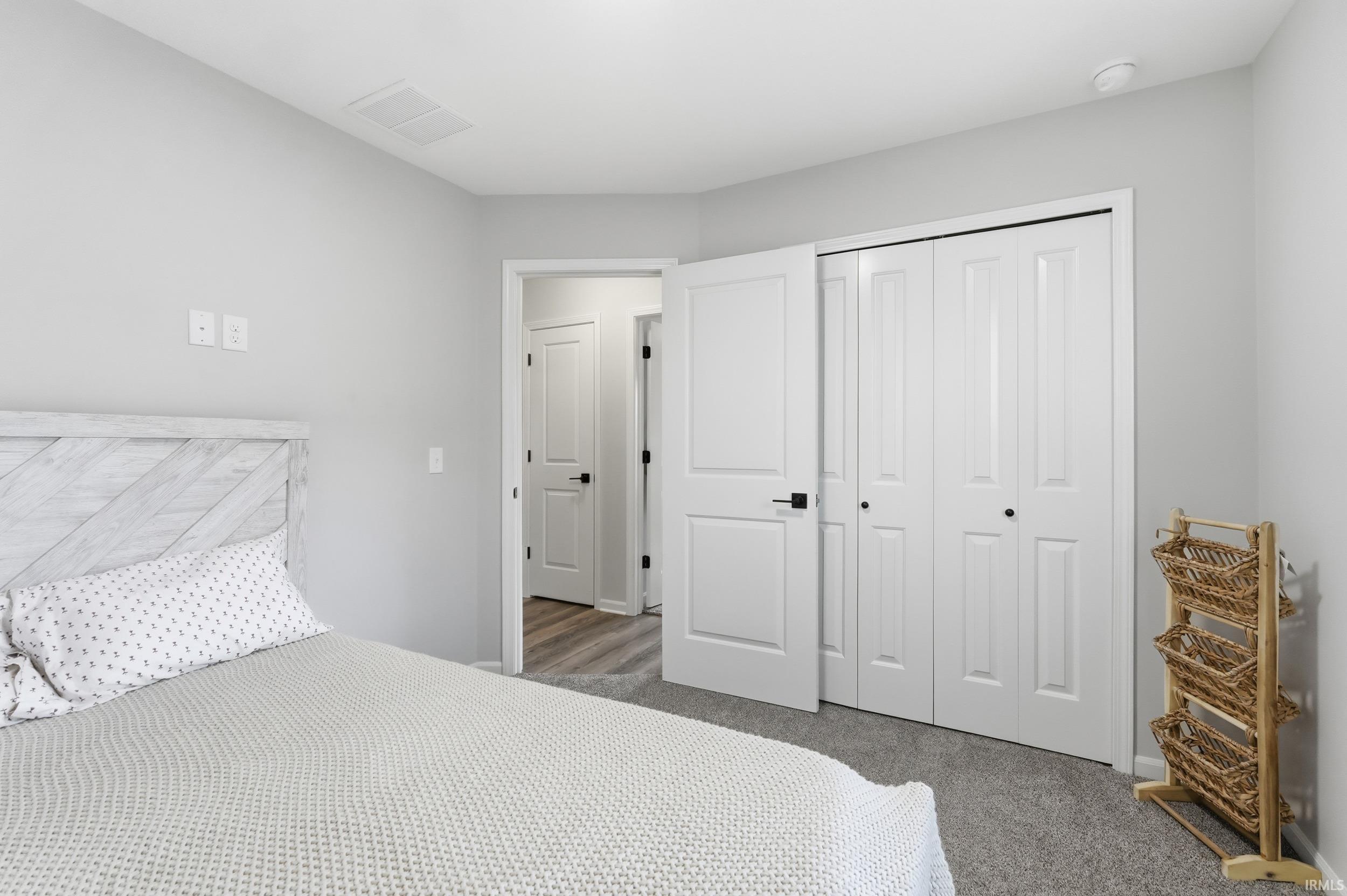 Bedroom with a closet and carpet floors
