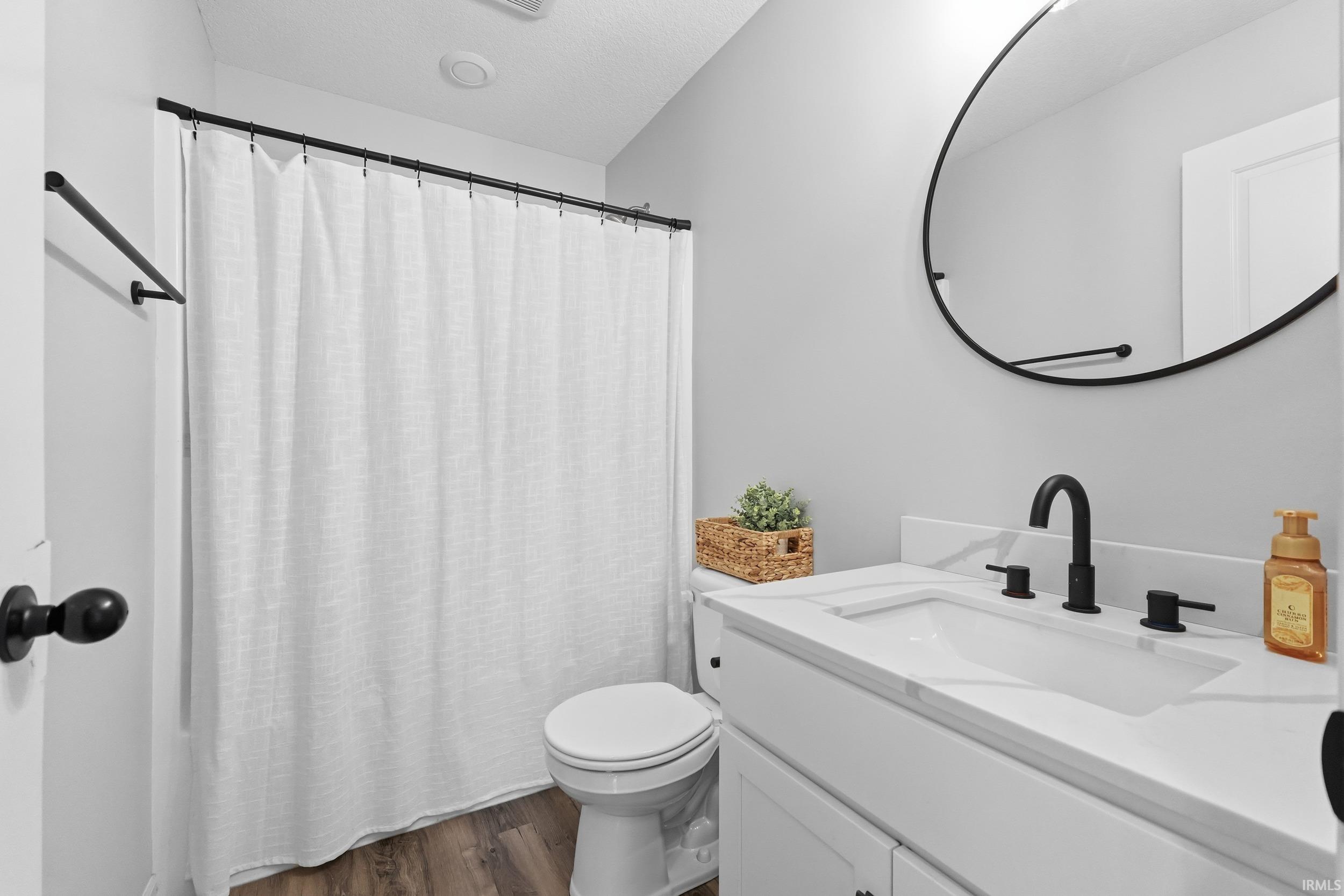 Bathroom with vanity and dark wood finished floors
