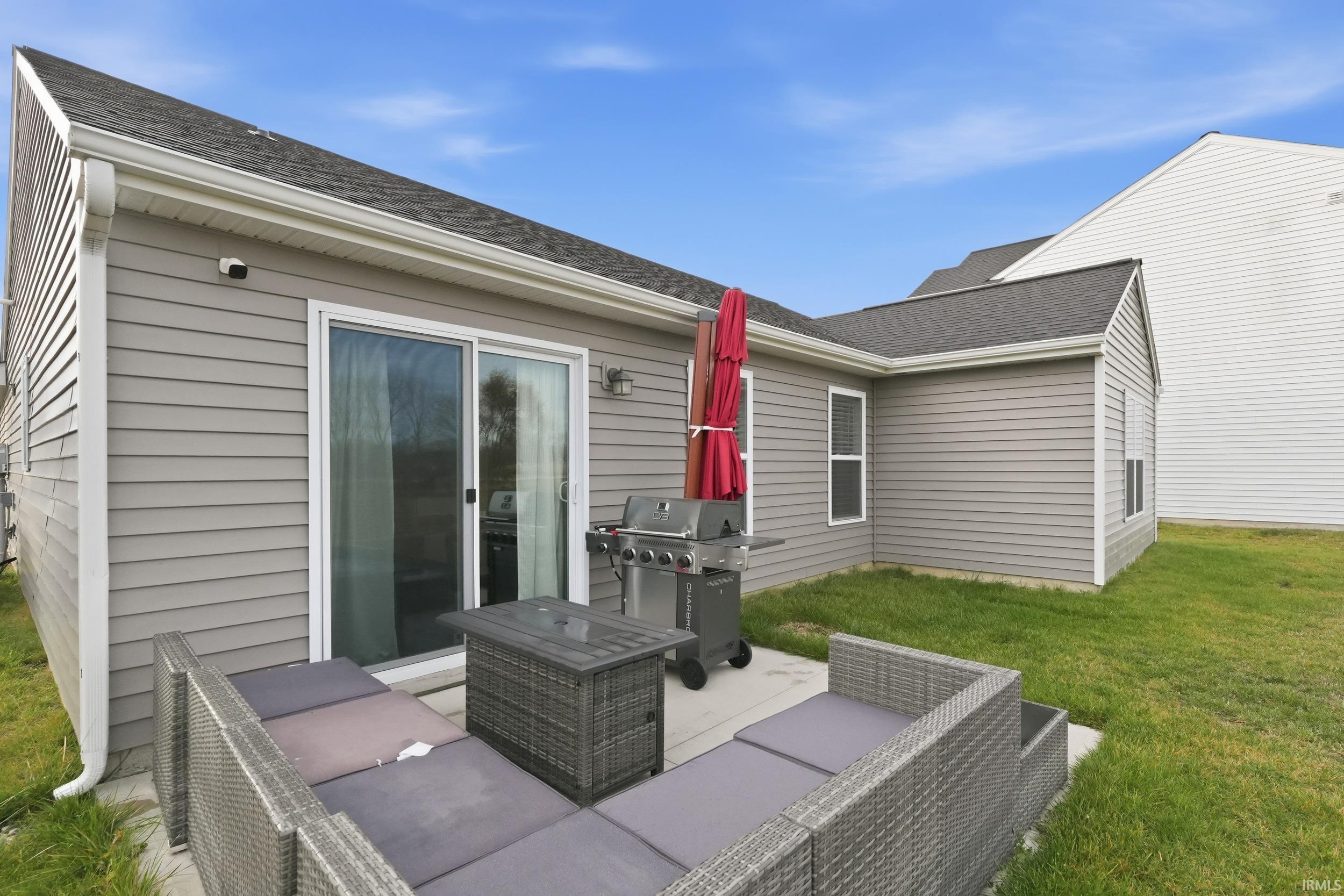 View of patio featuring a grill