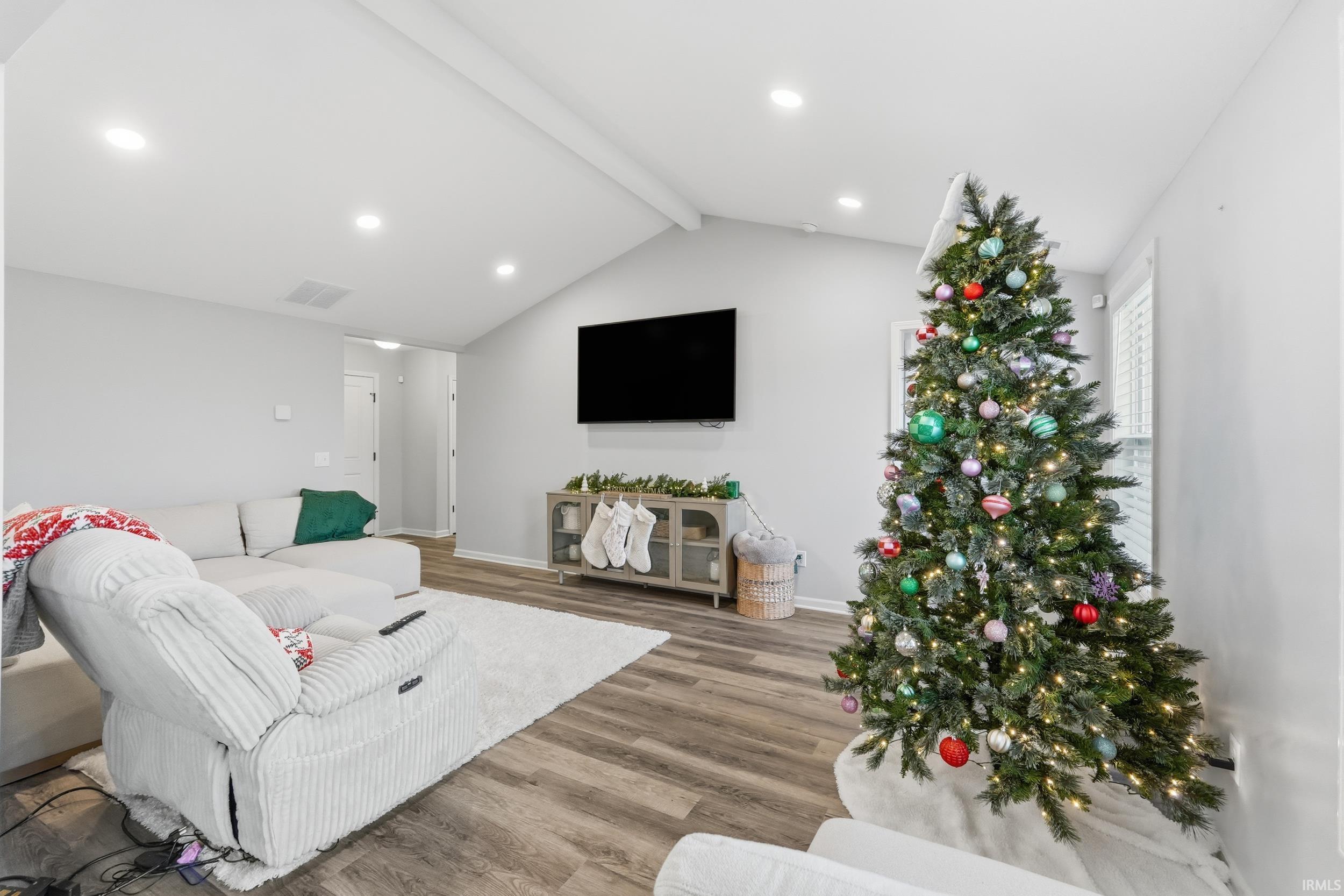 Living room featuring wood finished floors and baseboards