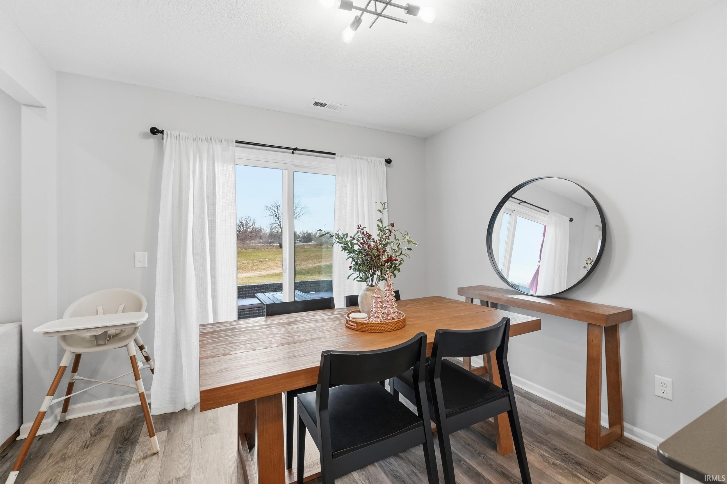 Dining area featuring wood finished floors