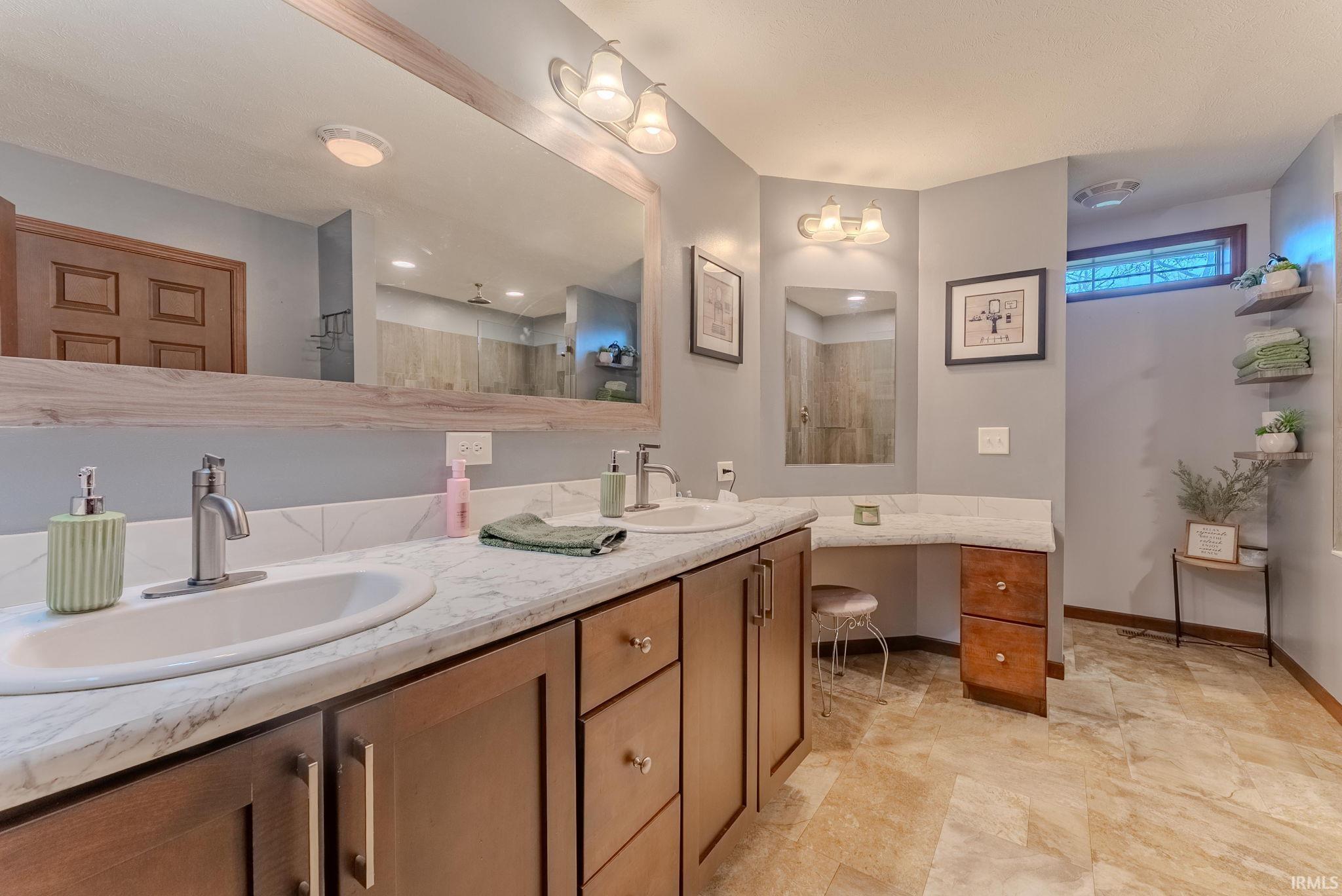 Bathroom with double vanity and walk in shower