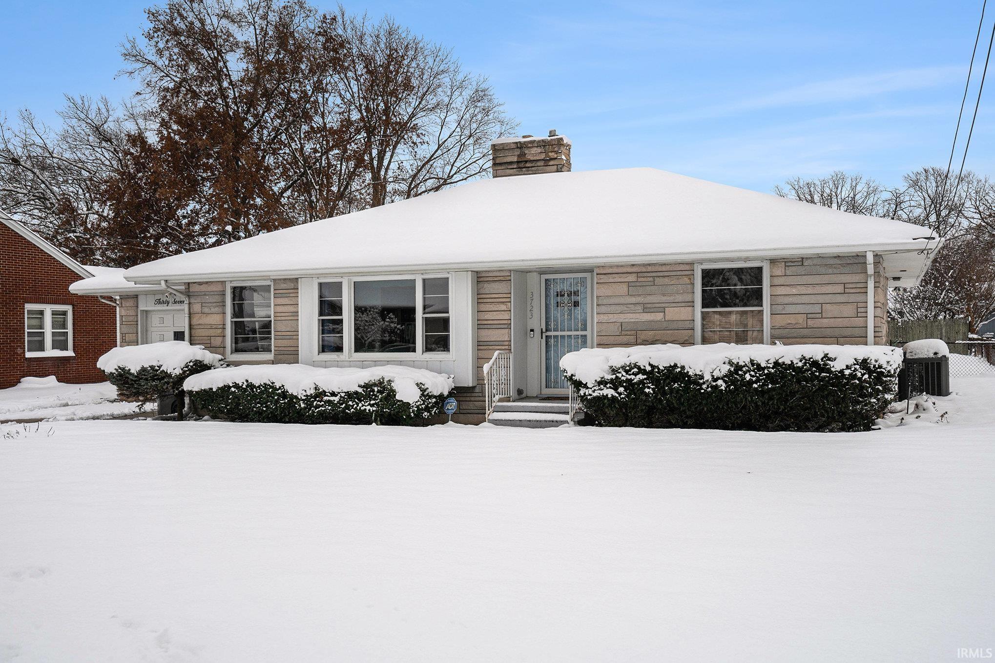 View of front of property featuring a chimney