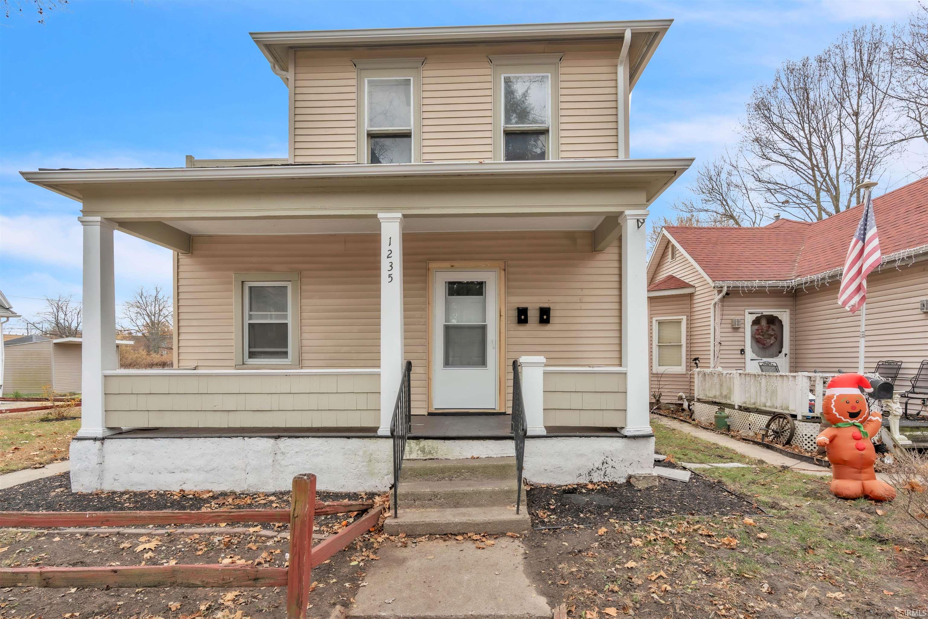 View of front of home featuring covered porch