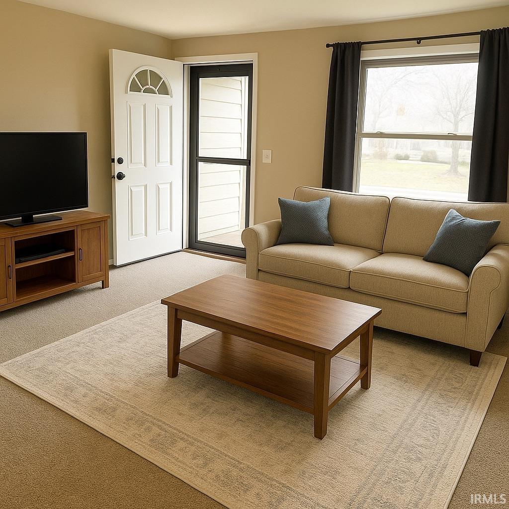 Living room featuring light carpet