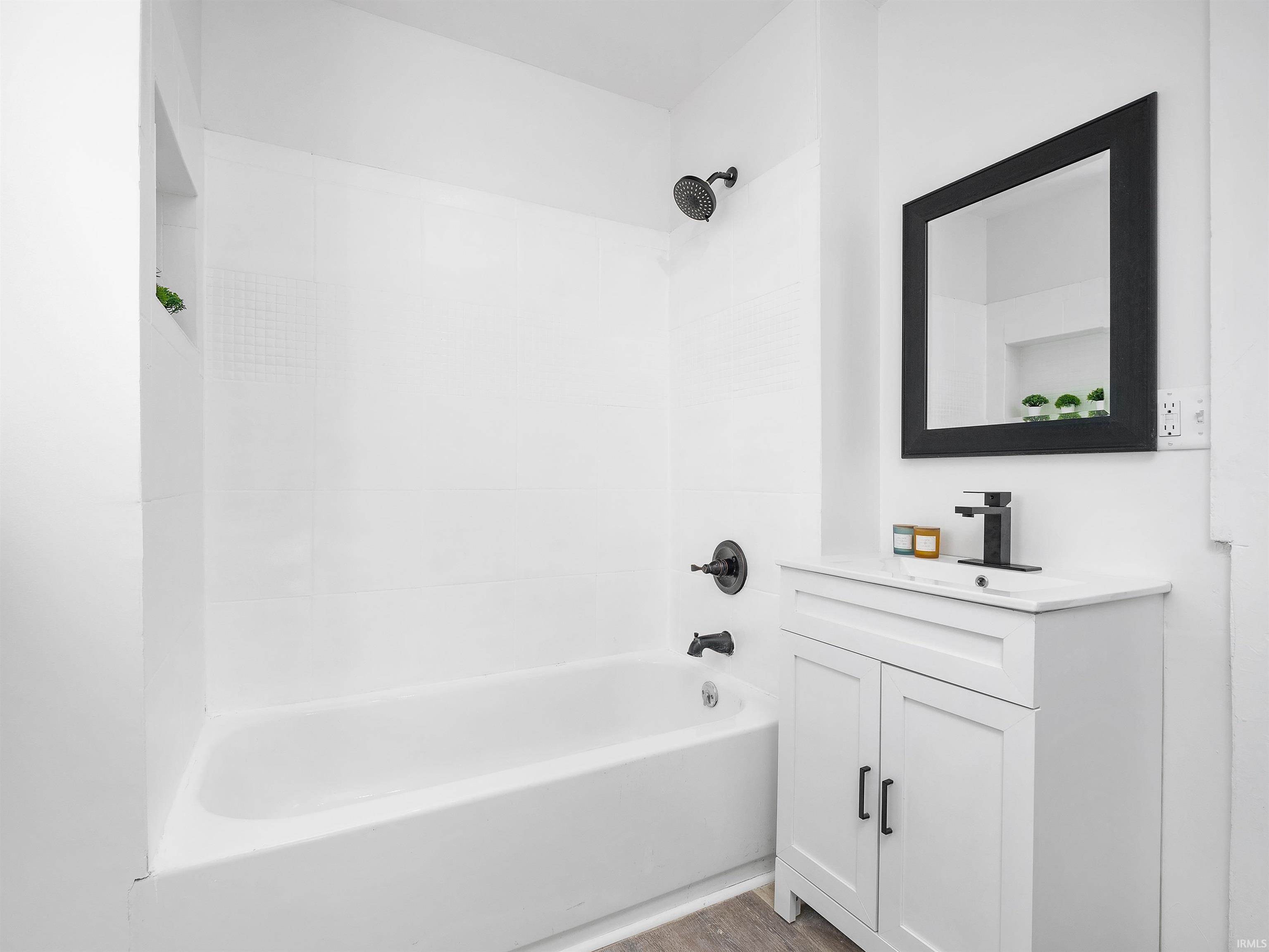 Bathroom with bathtub / shower combination and vanity