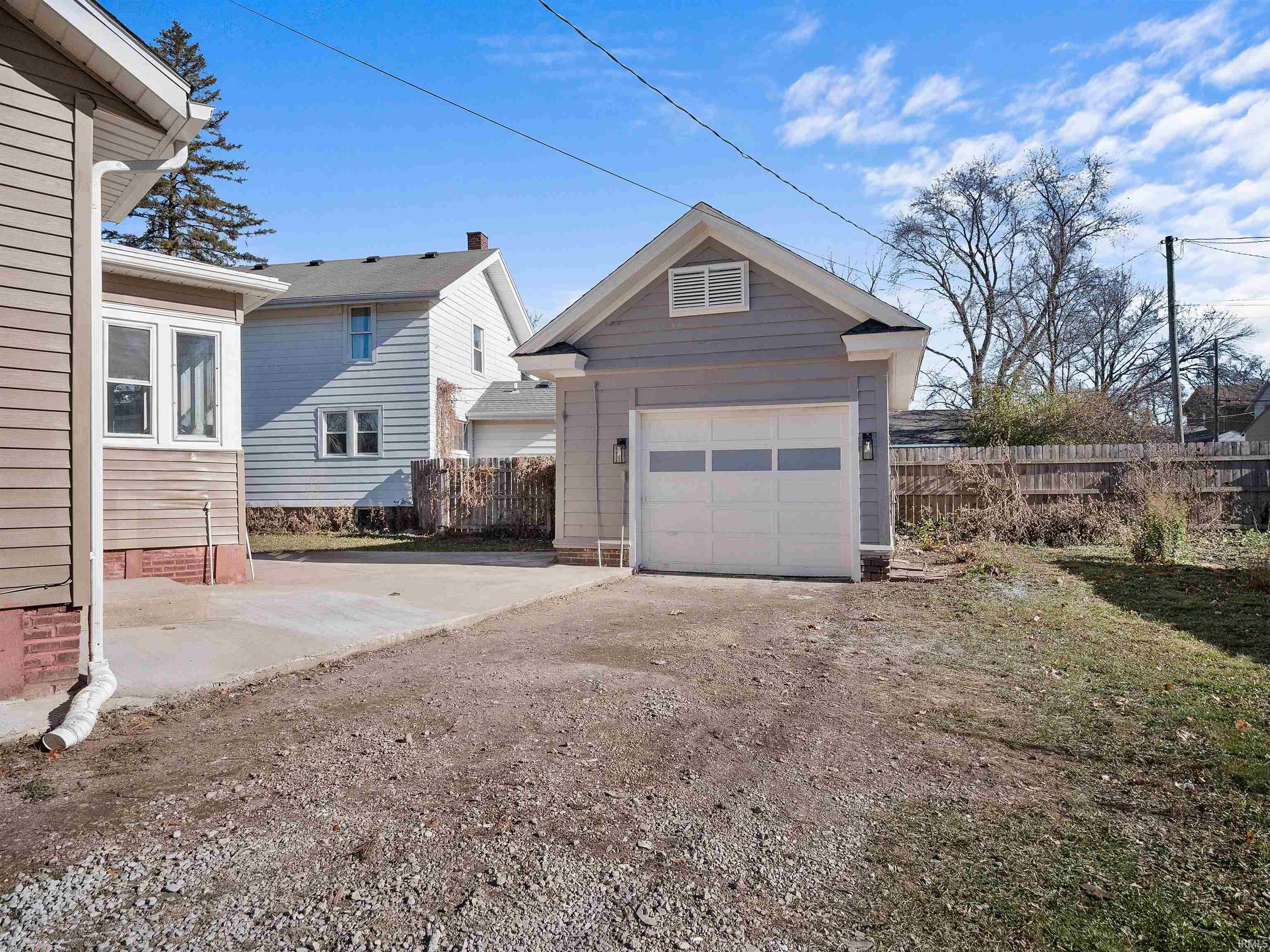 Garage featuring driveway