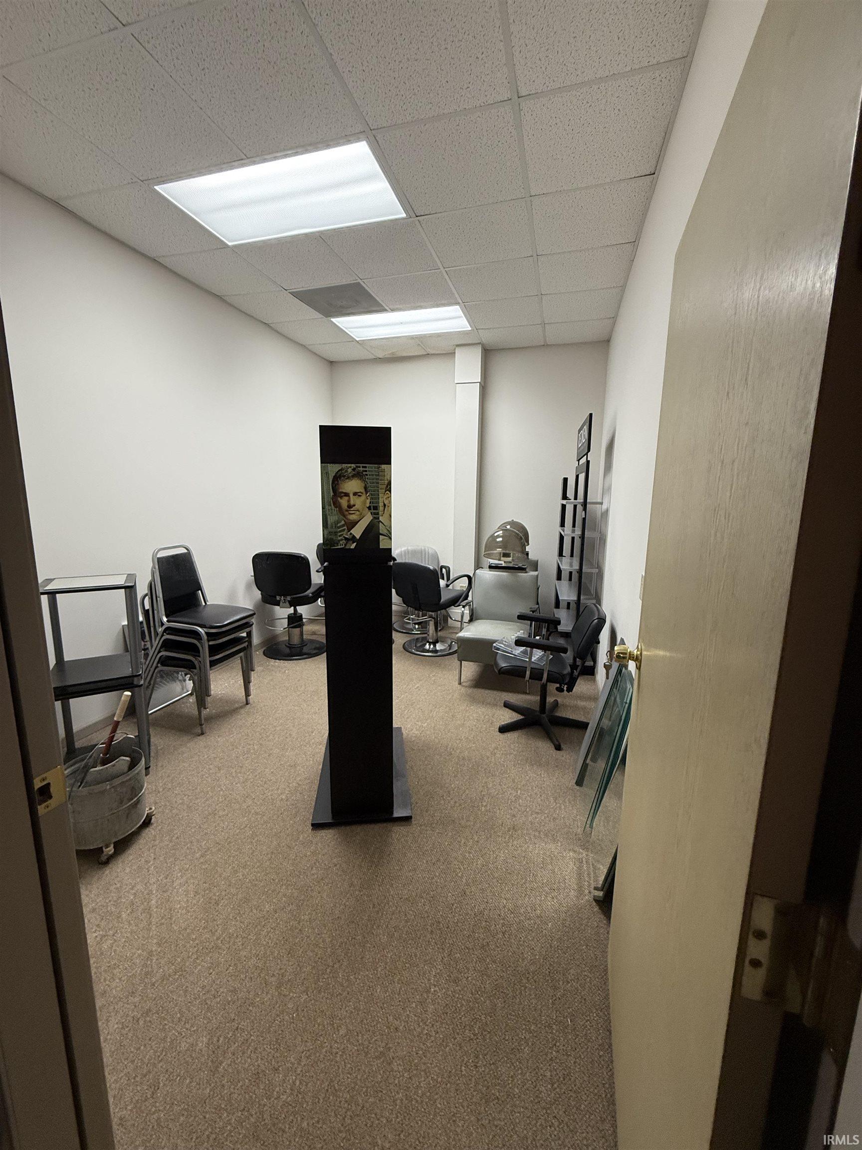 Exercise room featuring a paneled ceiling