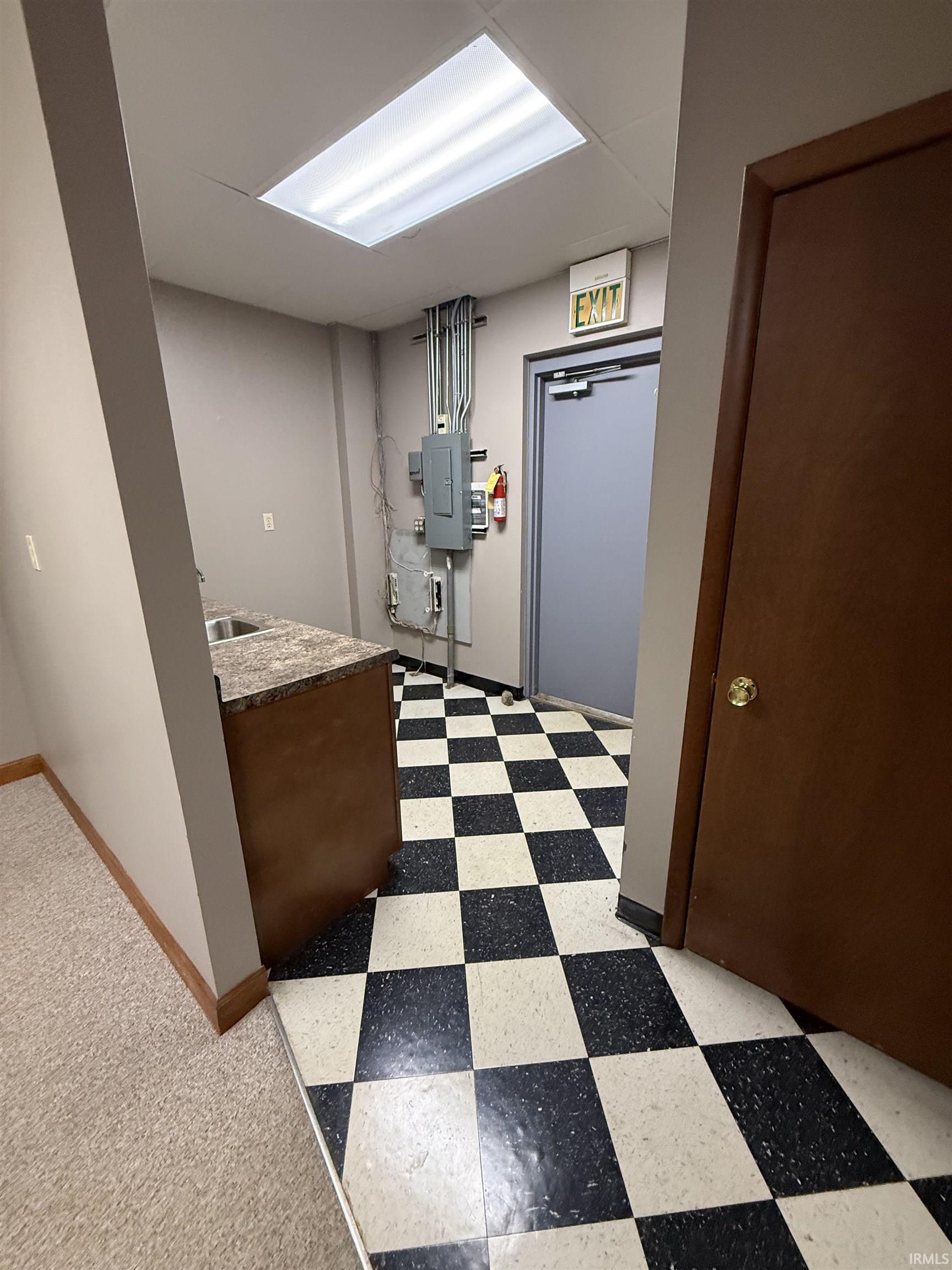 Laundry room featuring electric panel