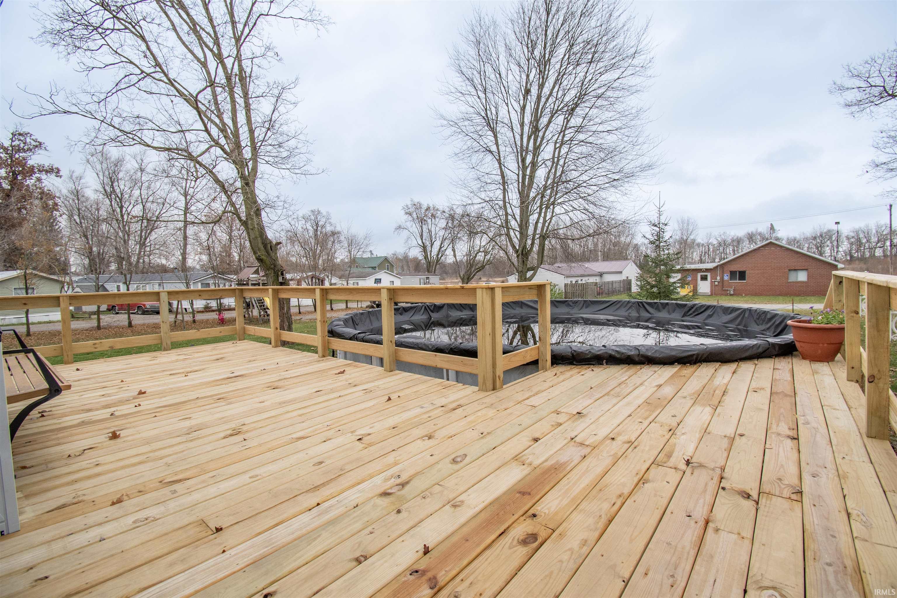 Wooden deck with a residential view