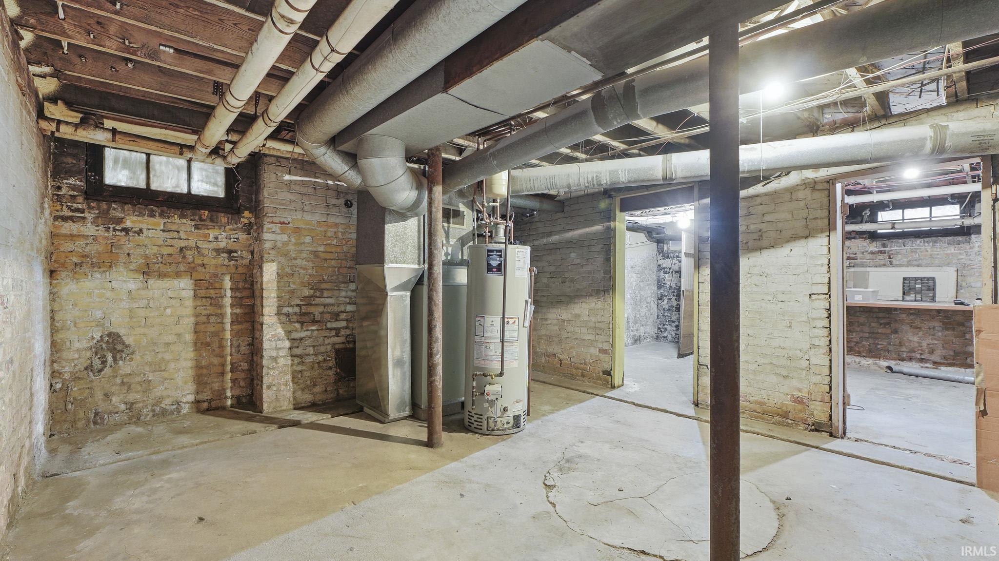 Basement with gas water heater and heating unit