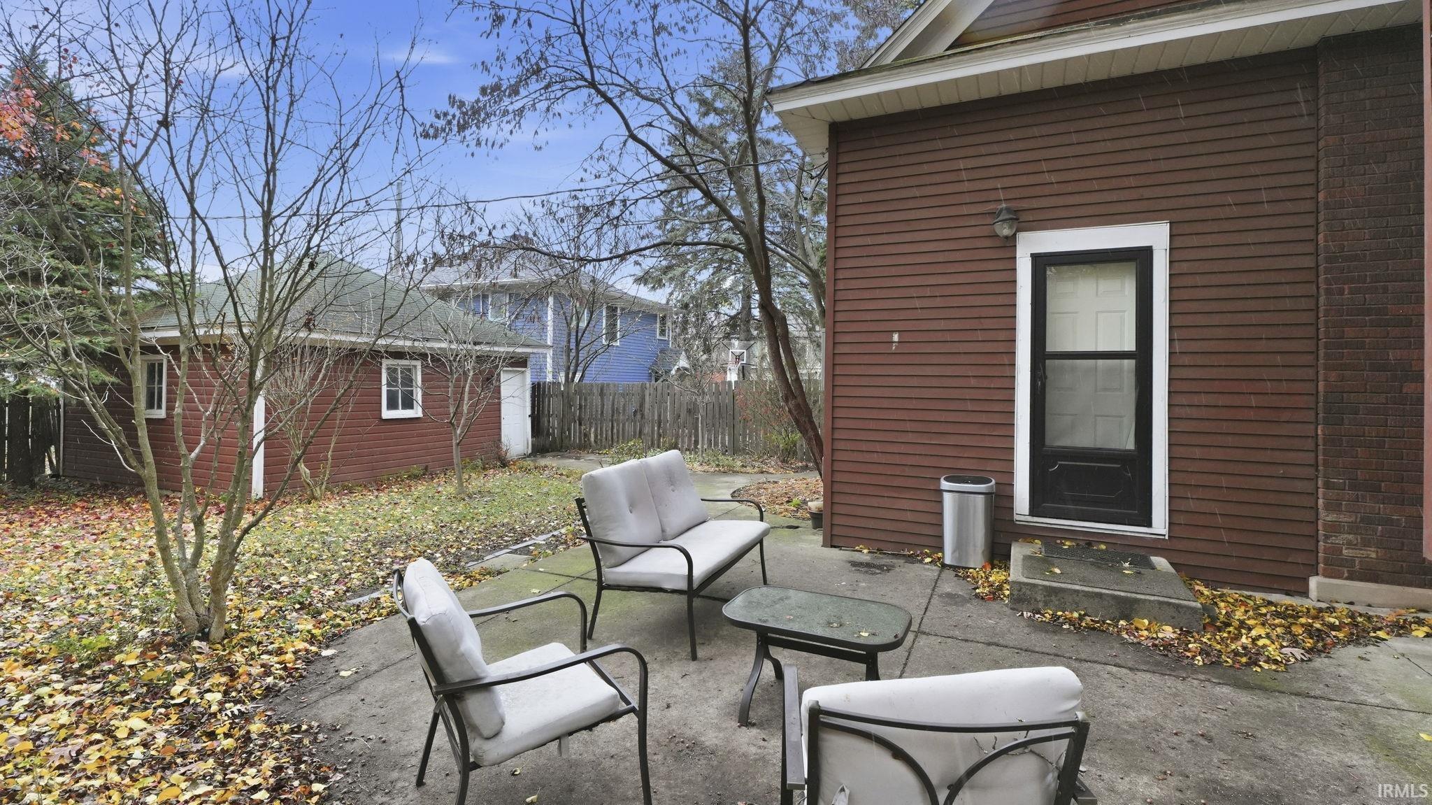 View of patio featuring an outbuilding