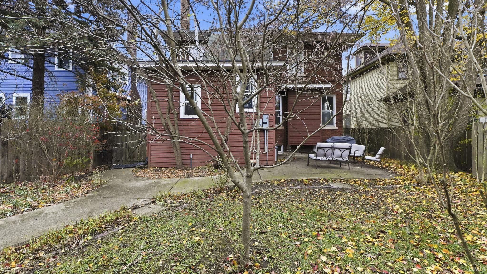 View of side of home featuring a patio