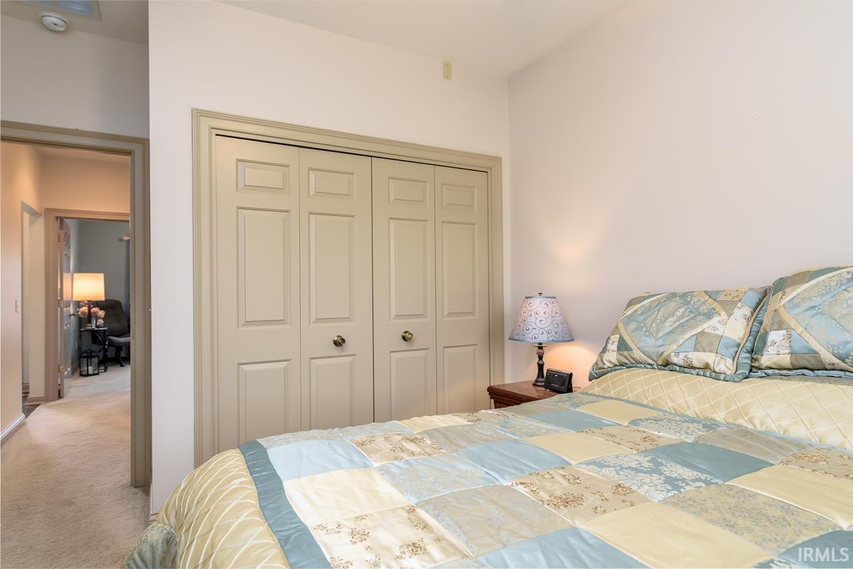 Bedroom featuring a closet and carpet floors