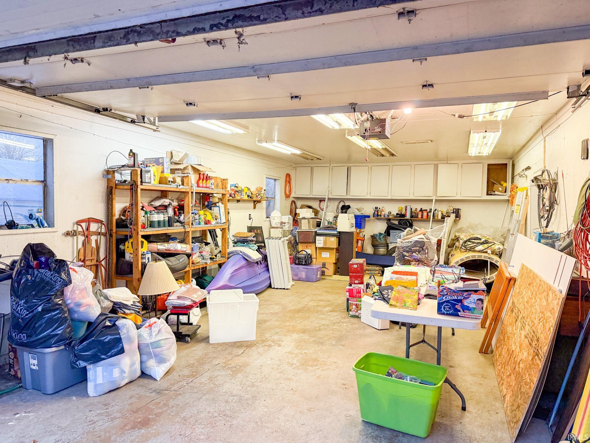 Garage featuring a garage door opener