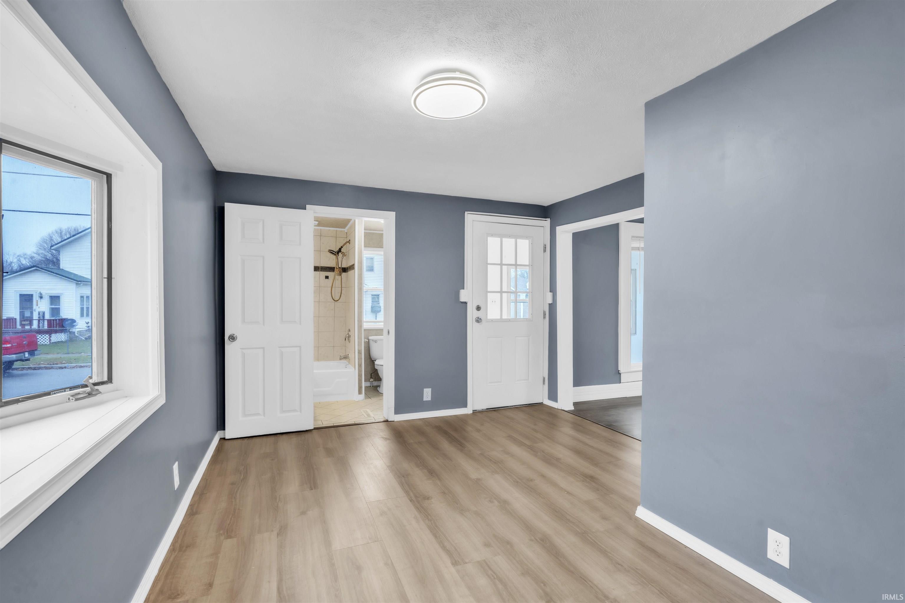 Entryway featuring light wood finished floors and baseboards