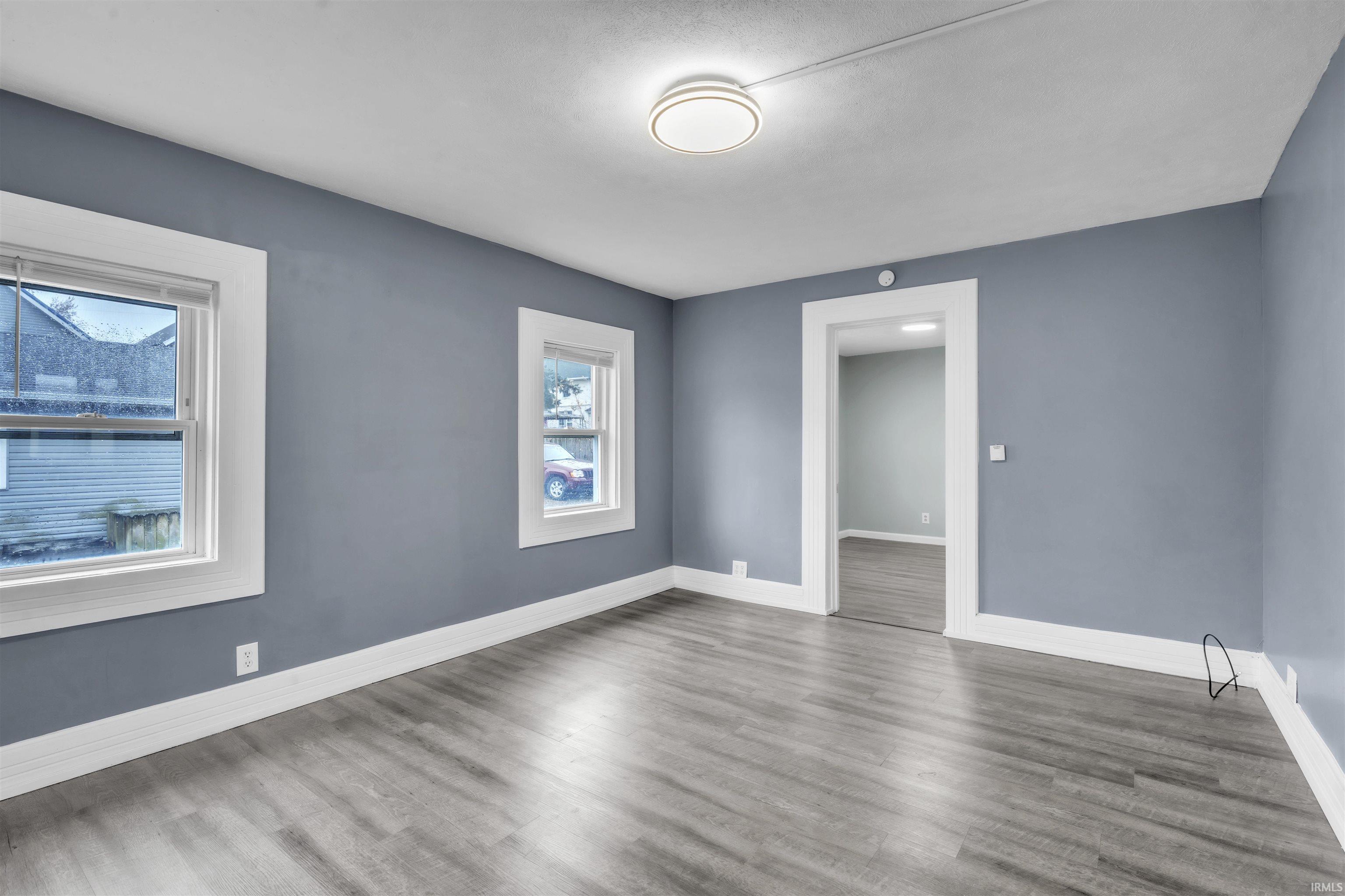 Unfurnished room with wood finished floors