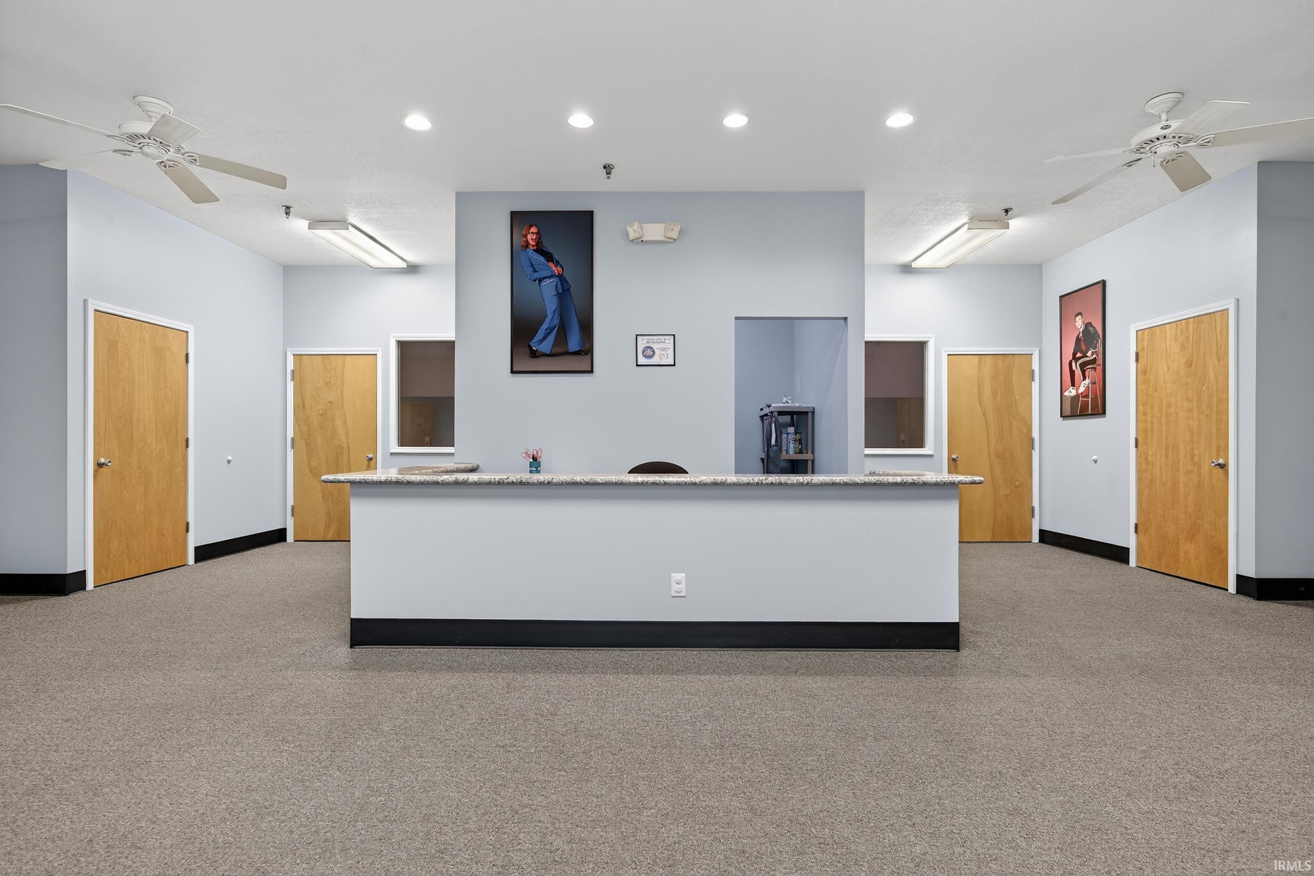 Reception featuring ceiling fan and recessed lighting