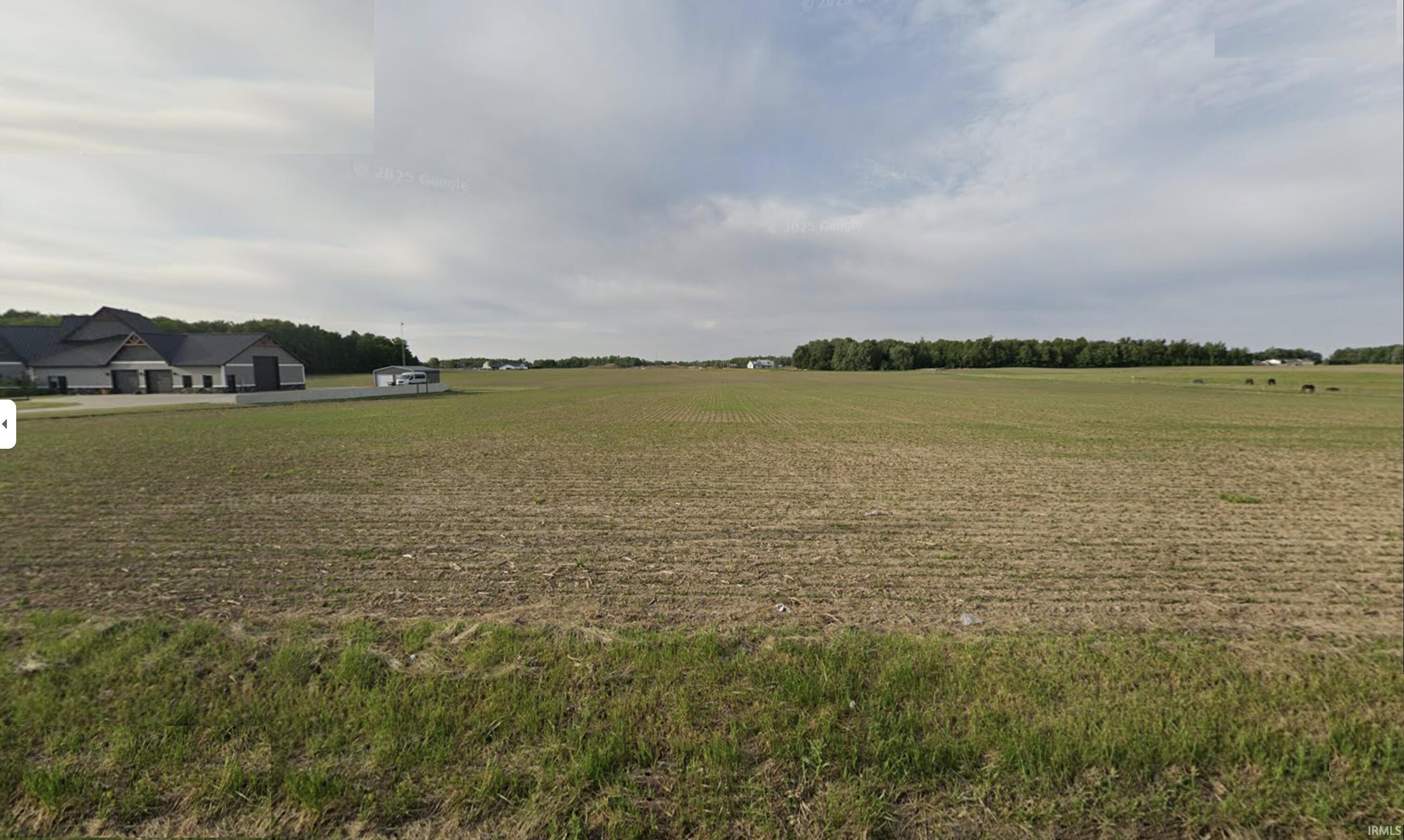 View of grassy yard with a rural view