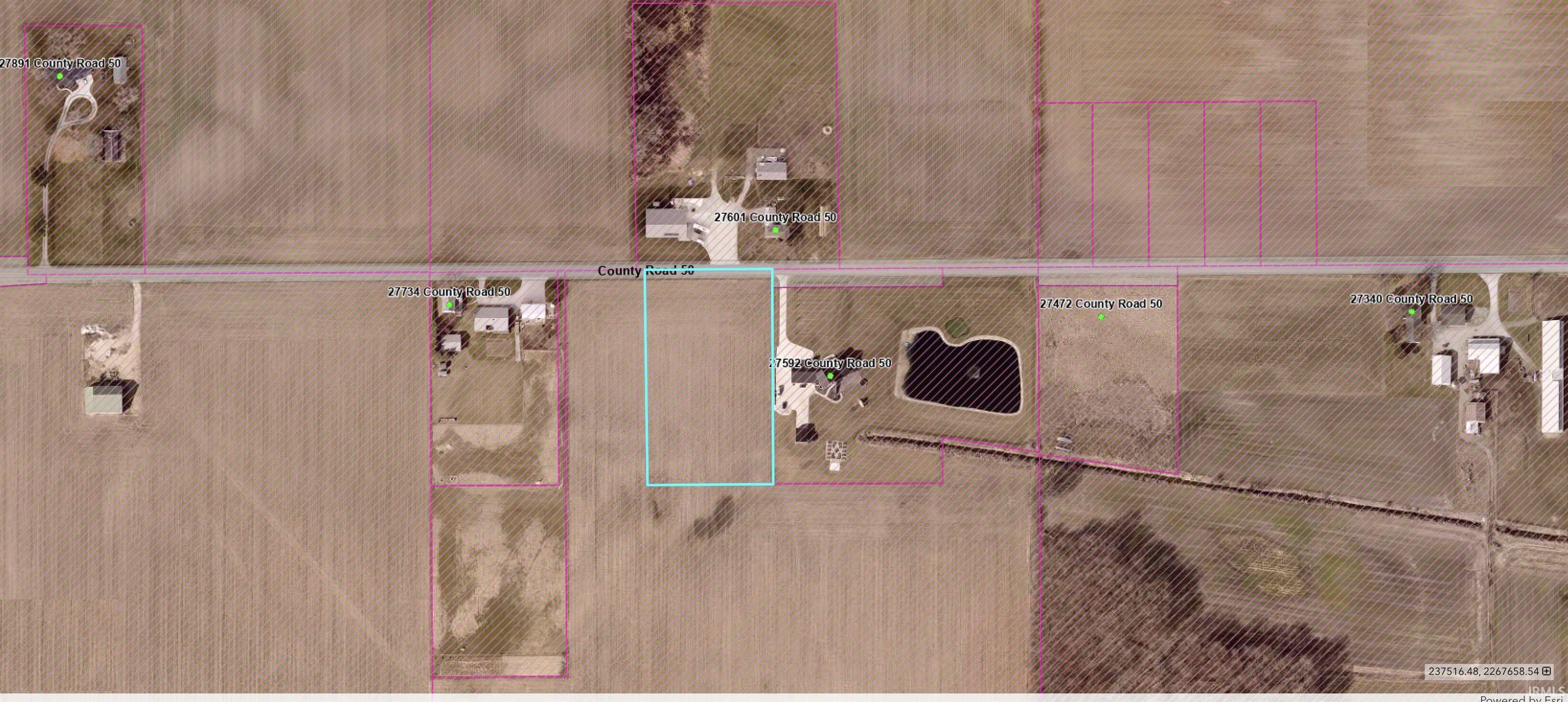 Aerial map of property and surrounding area featuring property parcel outlined