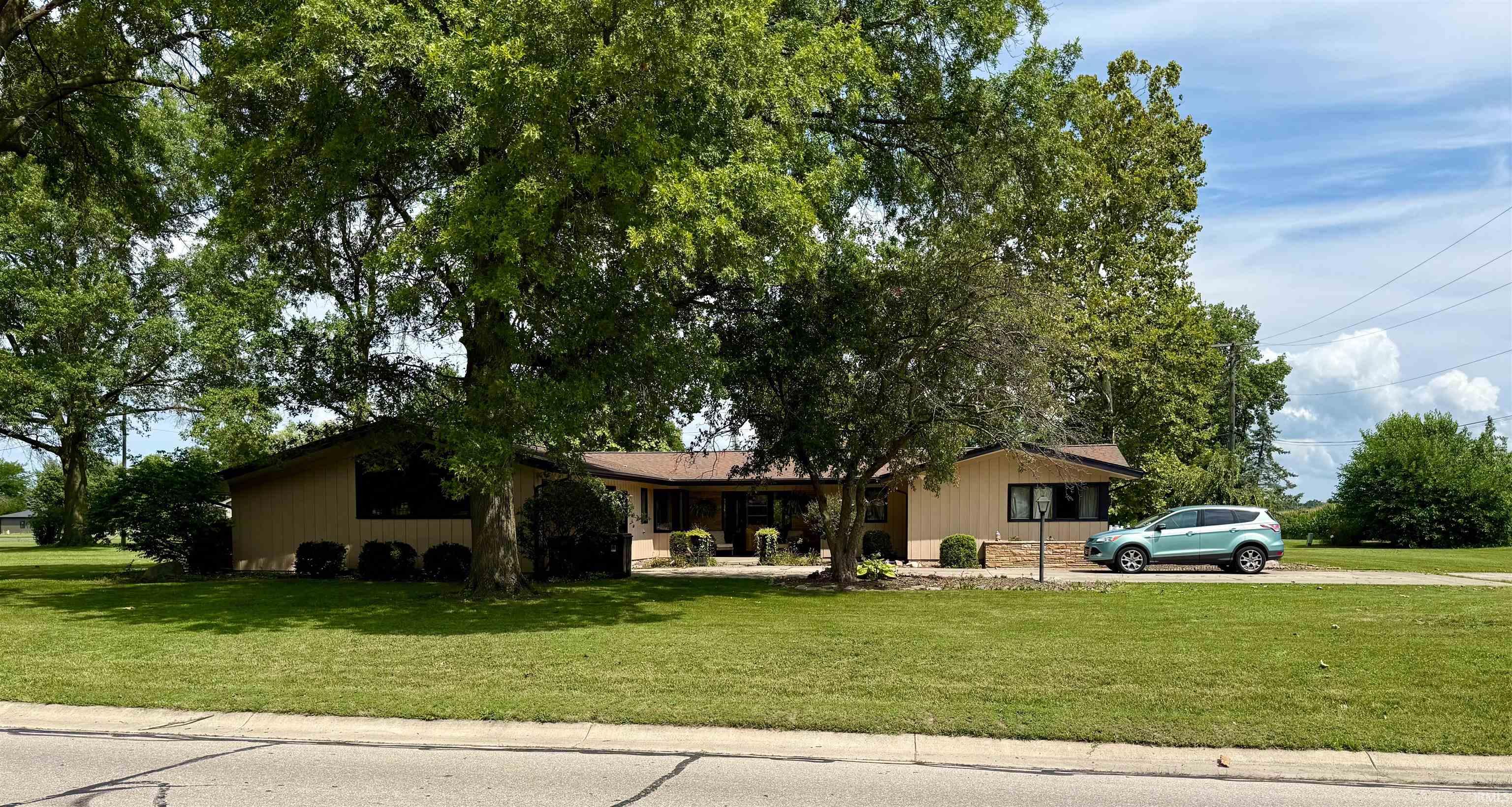 Single story home featuring a front yard