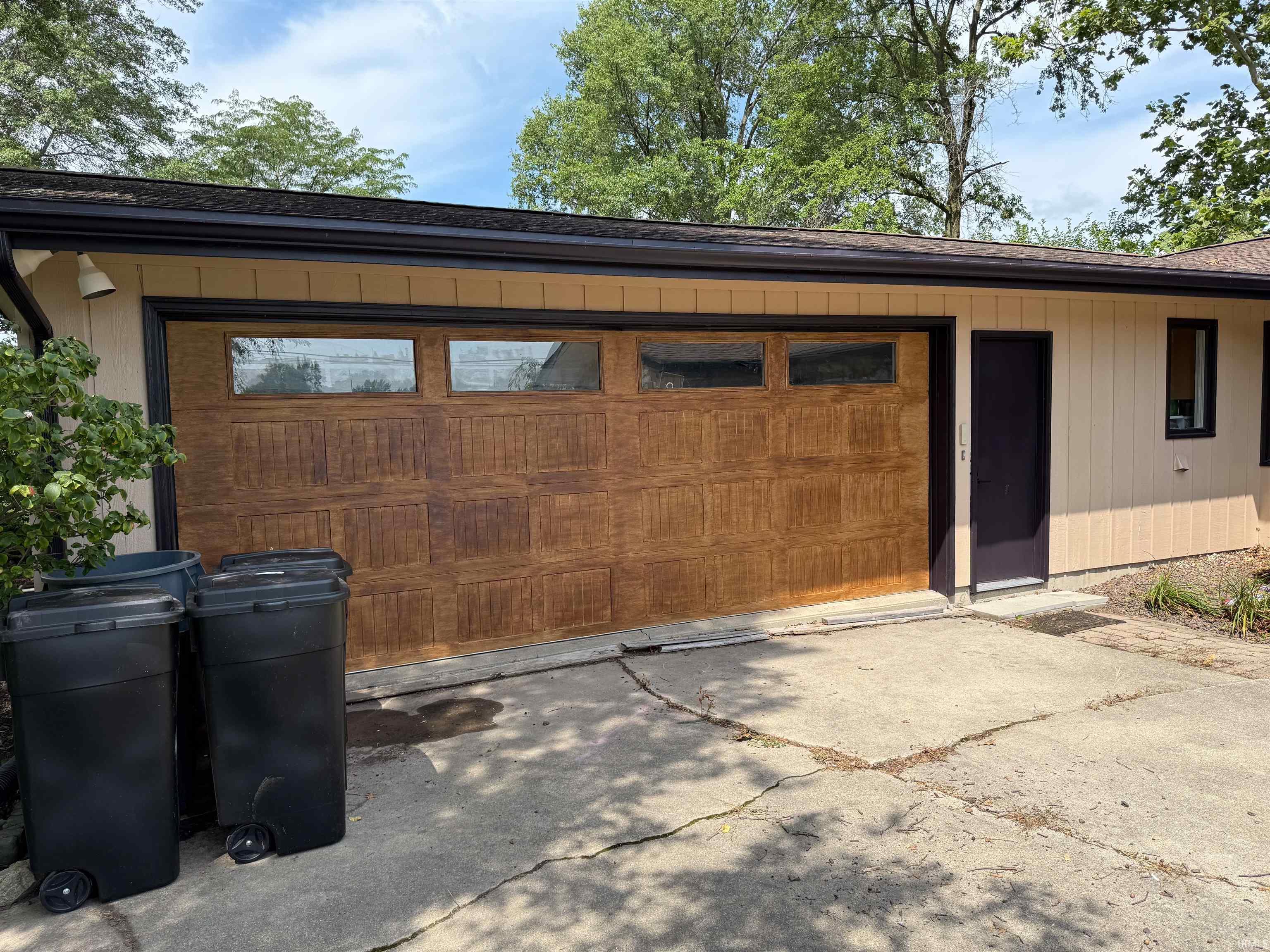 Garage featuring driveway