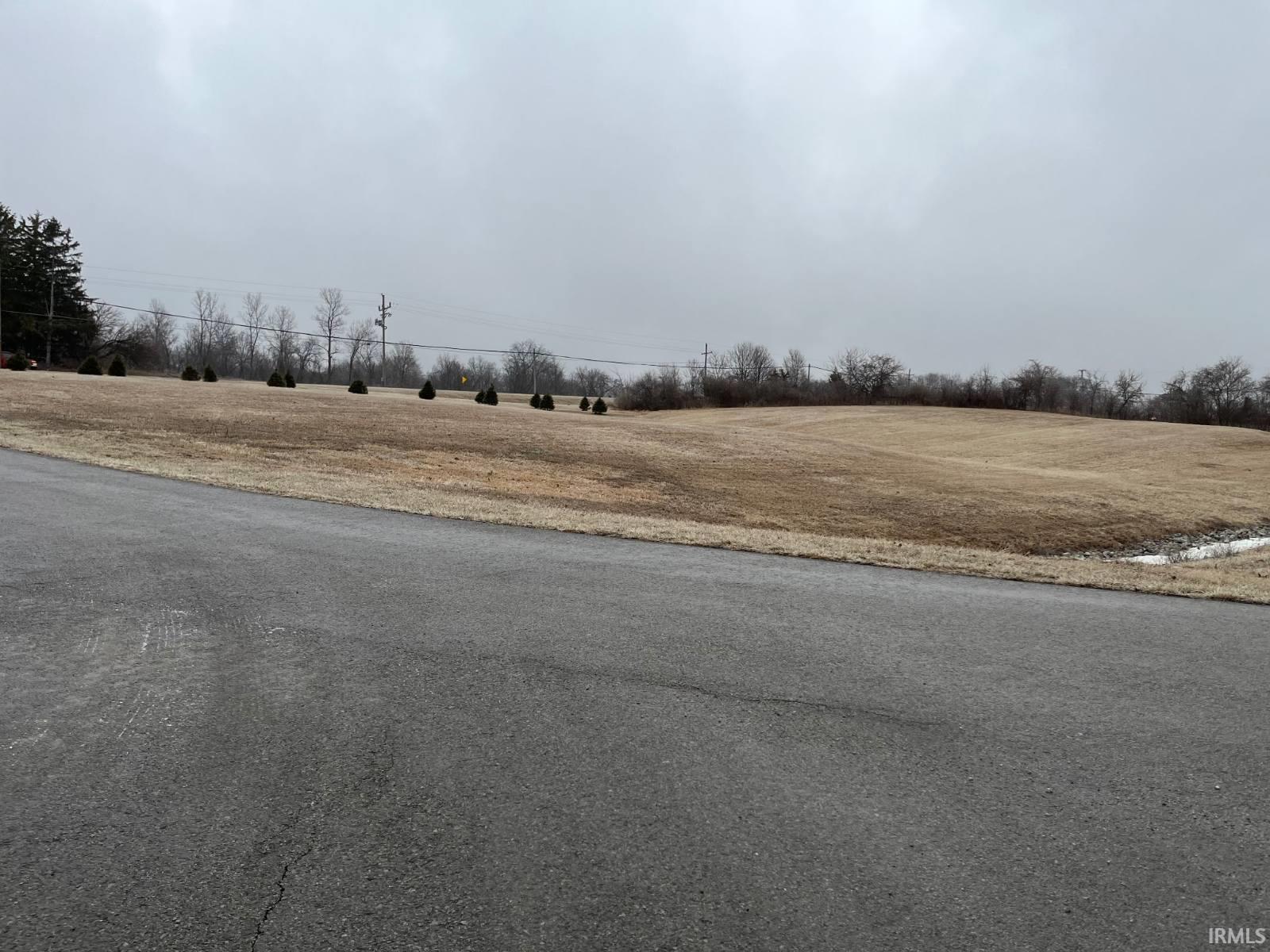 View of asphalt road with a rural view