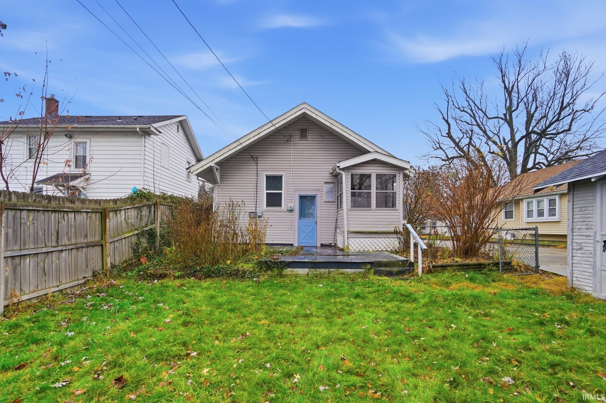 Rear view of property with a deck