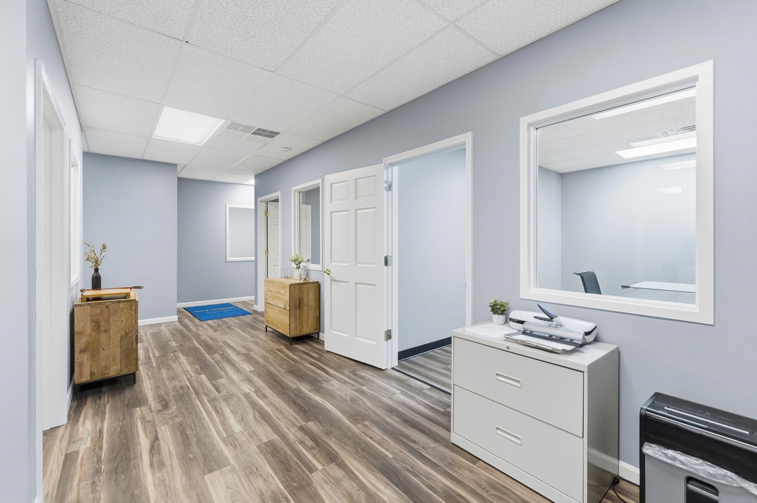 Office featuring a drop ceiling and wood finished floors