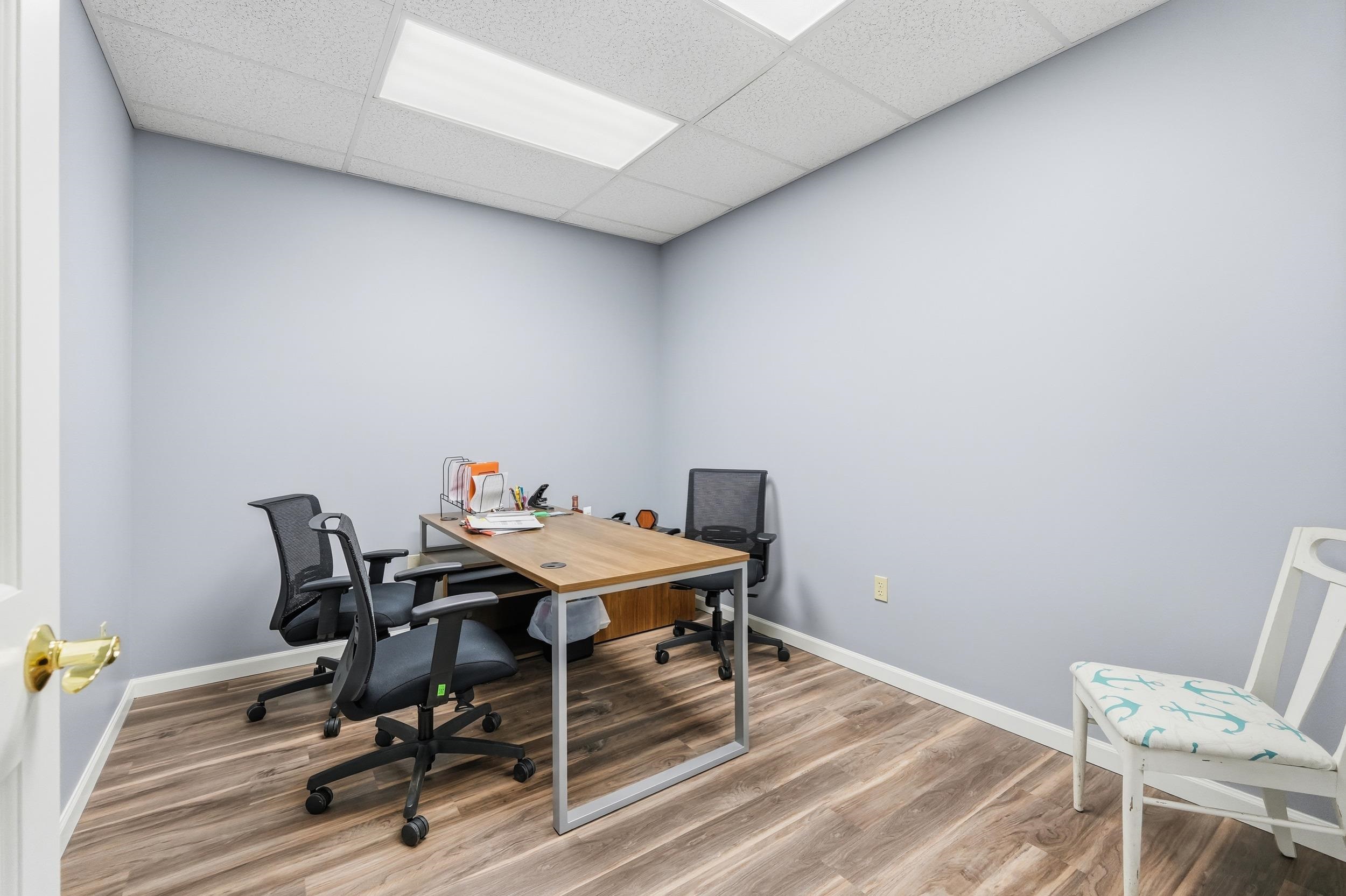 Office area featuring a paneled ceiling